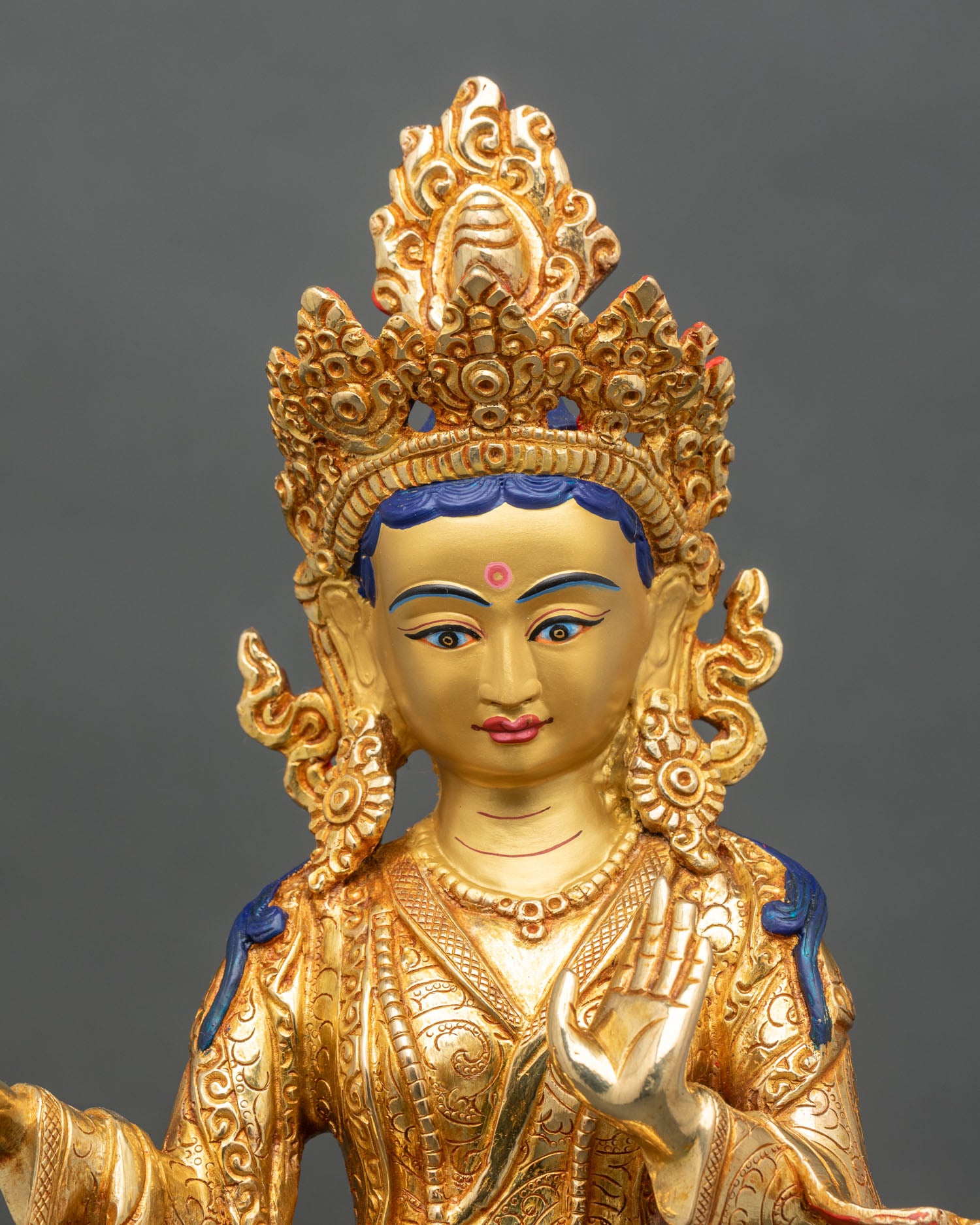 Right profile of Mandarava statue, standing dakini holding nectar vase and blessing mudra
