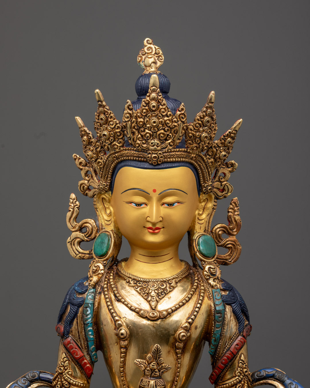 Detailed carving on the sanghati robe and lotus throne embellished with semi-precious stones on traditional Amitayus Buddha Statue.