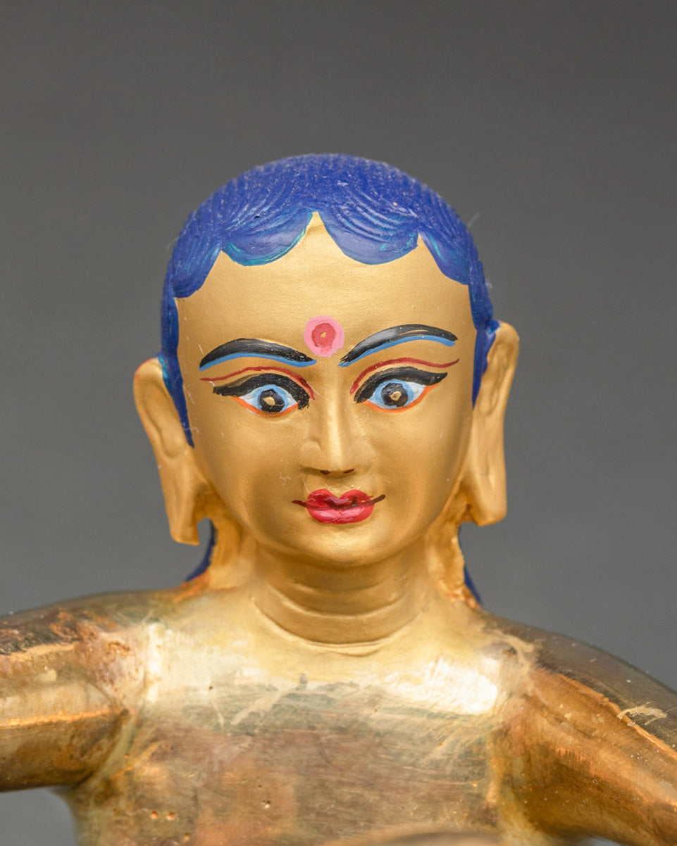Detailed close-up of Samantabhadri consort face in Samantabhadra Yab-Yum sculpture
