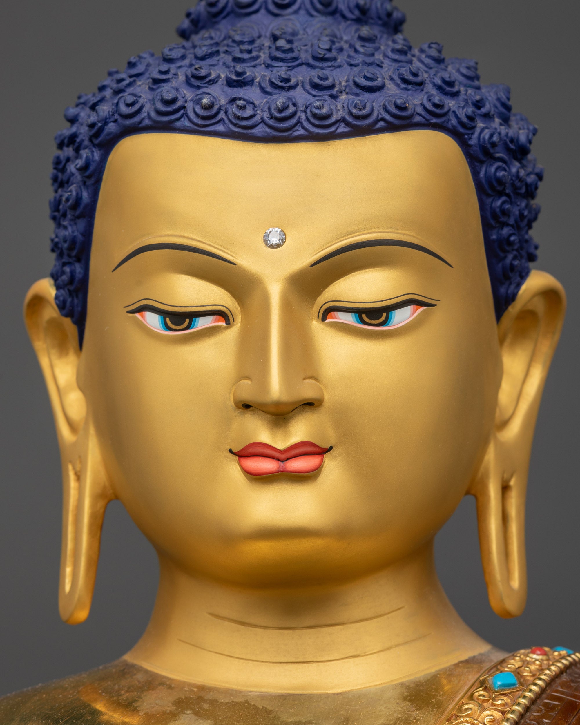 Detailed close up face of Gautama Buddha showing serene expression and intricate details