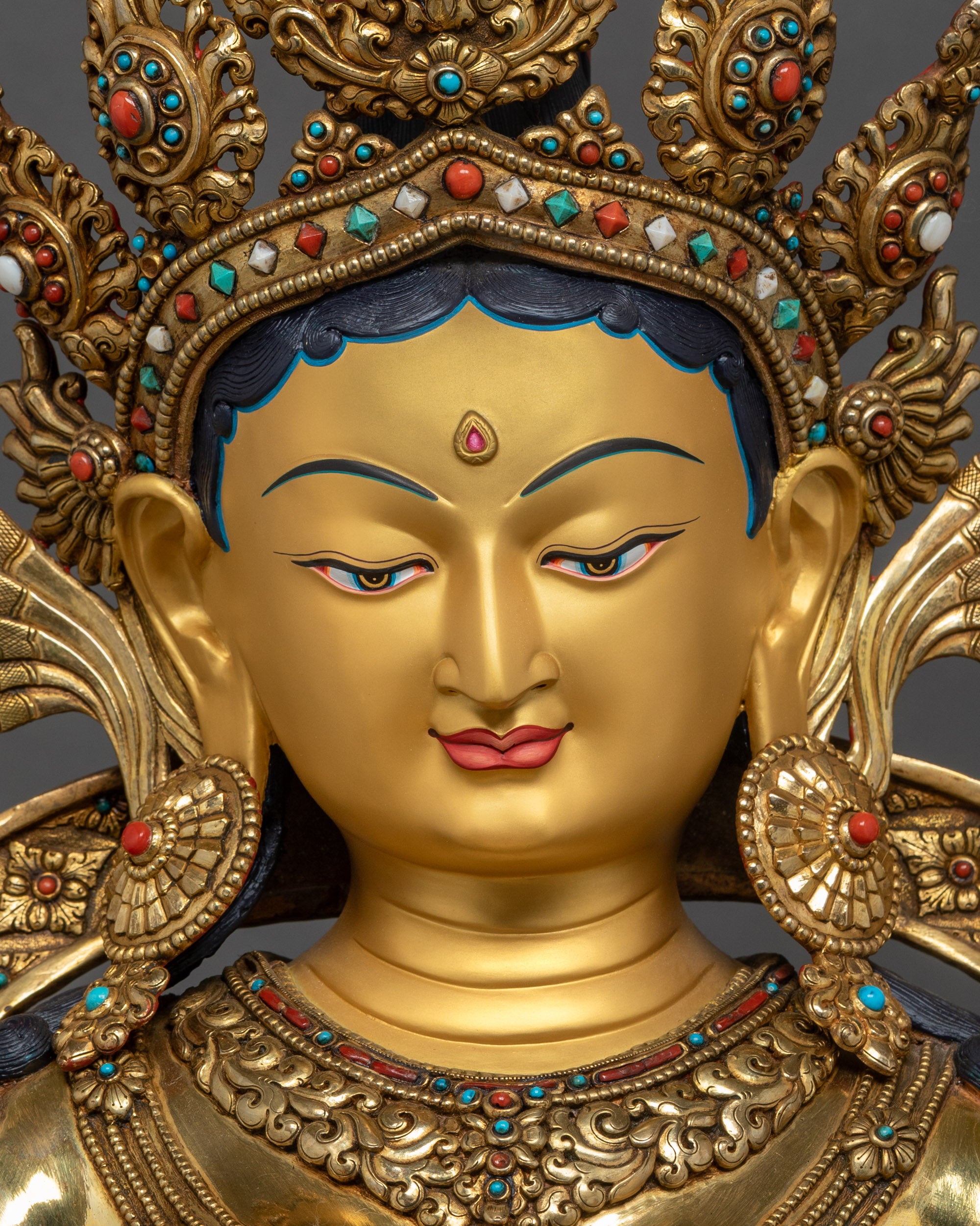 Detailed close up face of Mother Tara handcrafted Nepalese Buddhist statue