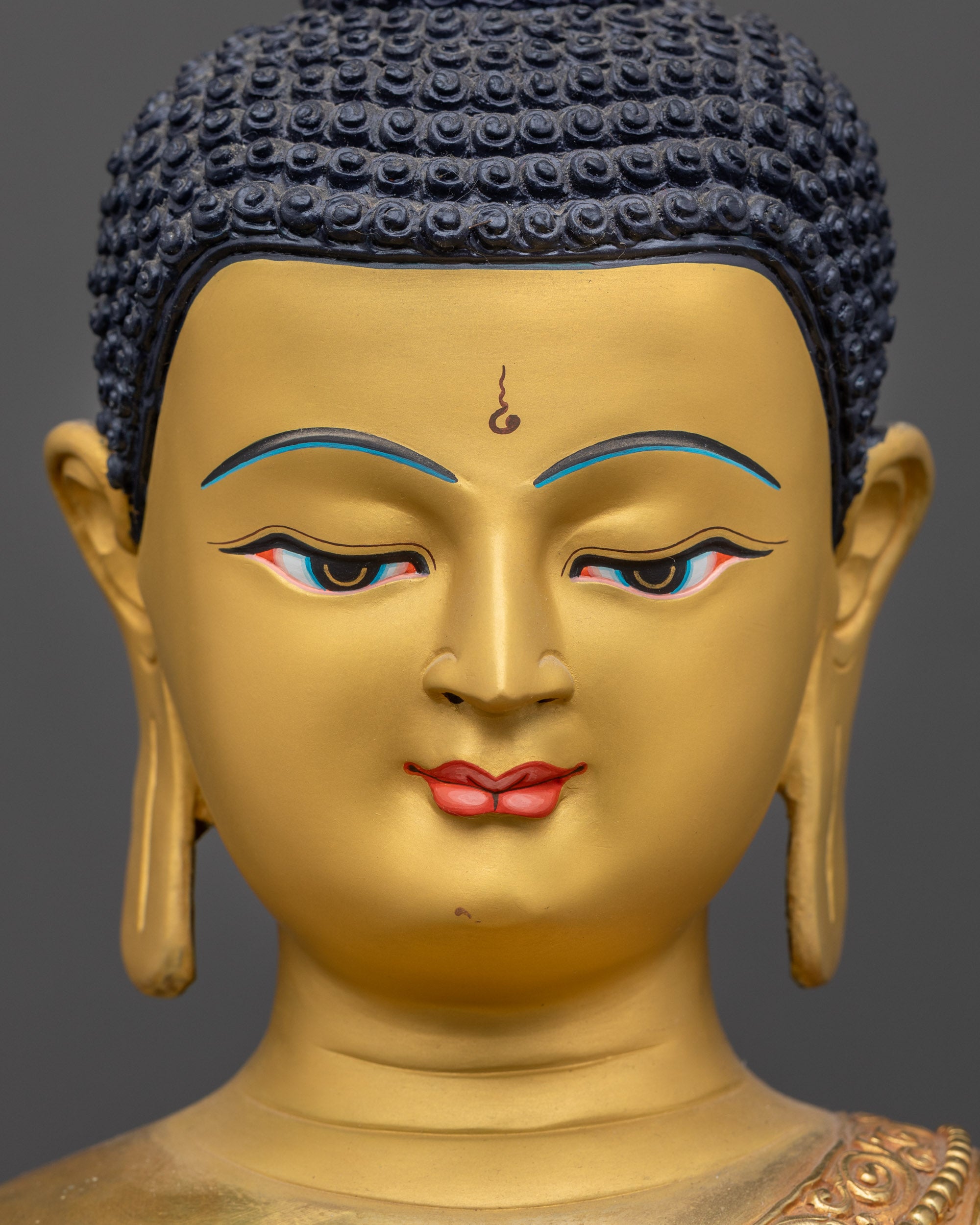 Detailed close up face of Siddhartha Gautama Buddha with serene gold-gilded expression
