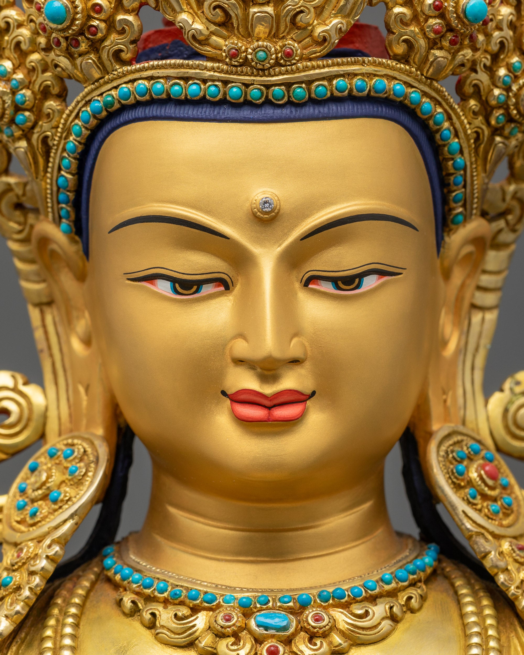 Detailed close up of Amitayus Buddha face with floral halo and semi-precious stones