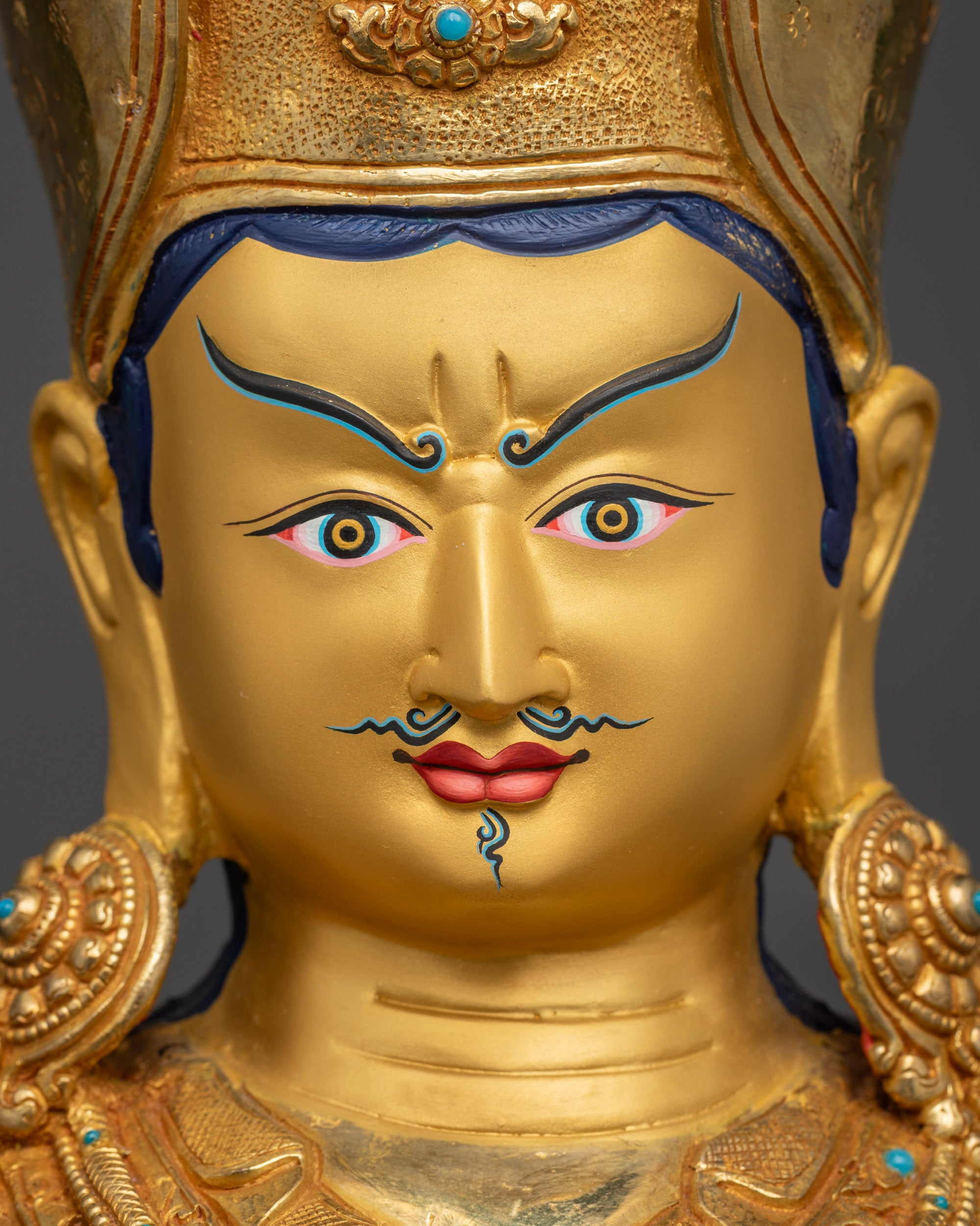 Detailed close up of Guru Rinpoche face with wrathful yet compassionate expression