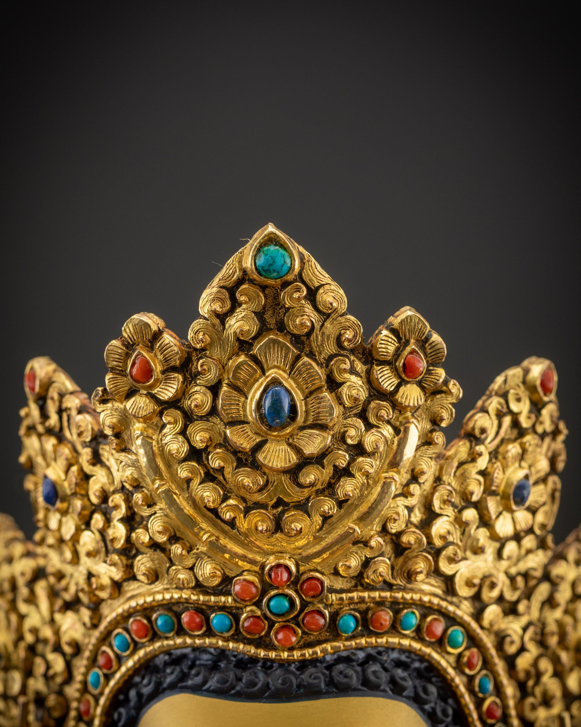 Detailed close up of five-jeweled crown on handcrafted Jowo Rinpoche Buddha
Statue