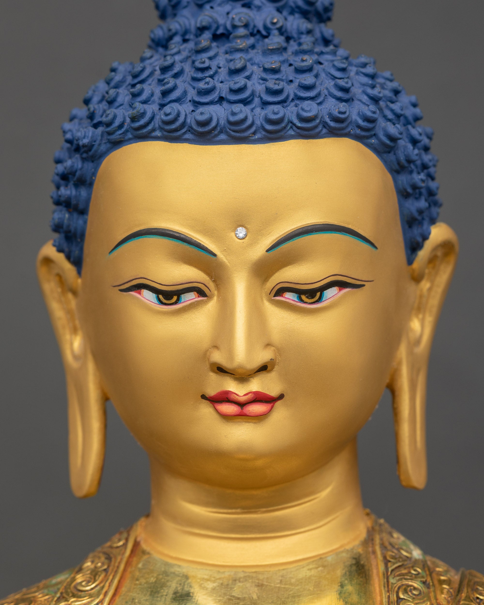 Detailed close up of the face Gold fire gilded Amitabha Buddha face with calm expression and serene eyes