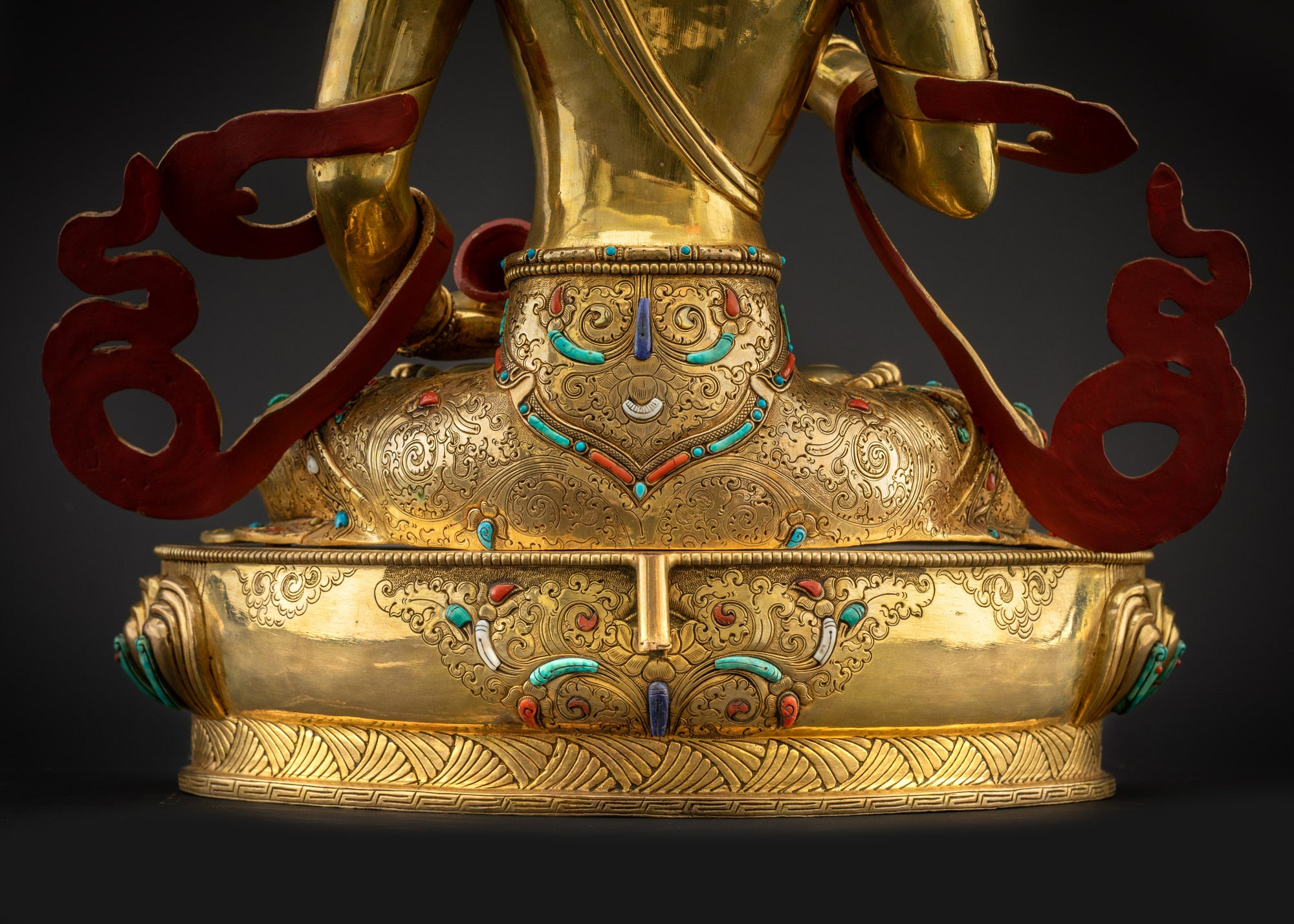 Detailed landscape back shot statue seated on lotus seat showing robe and base