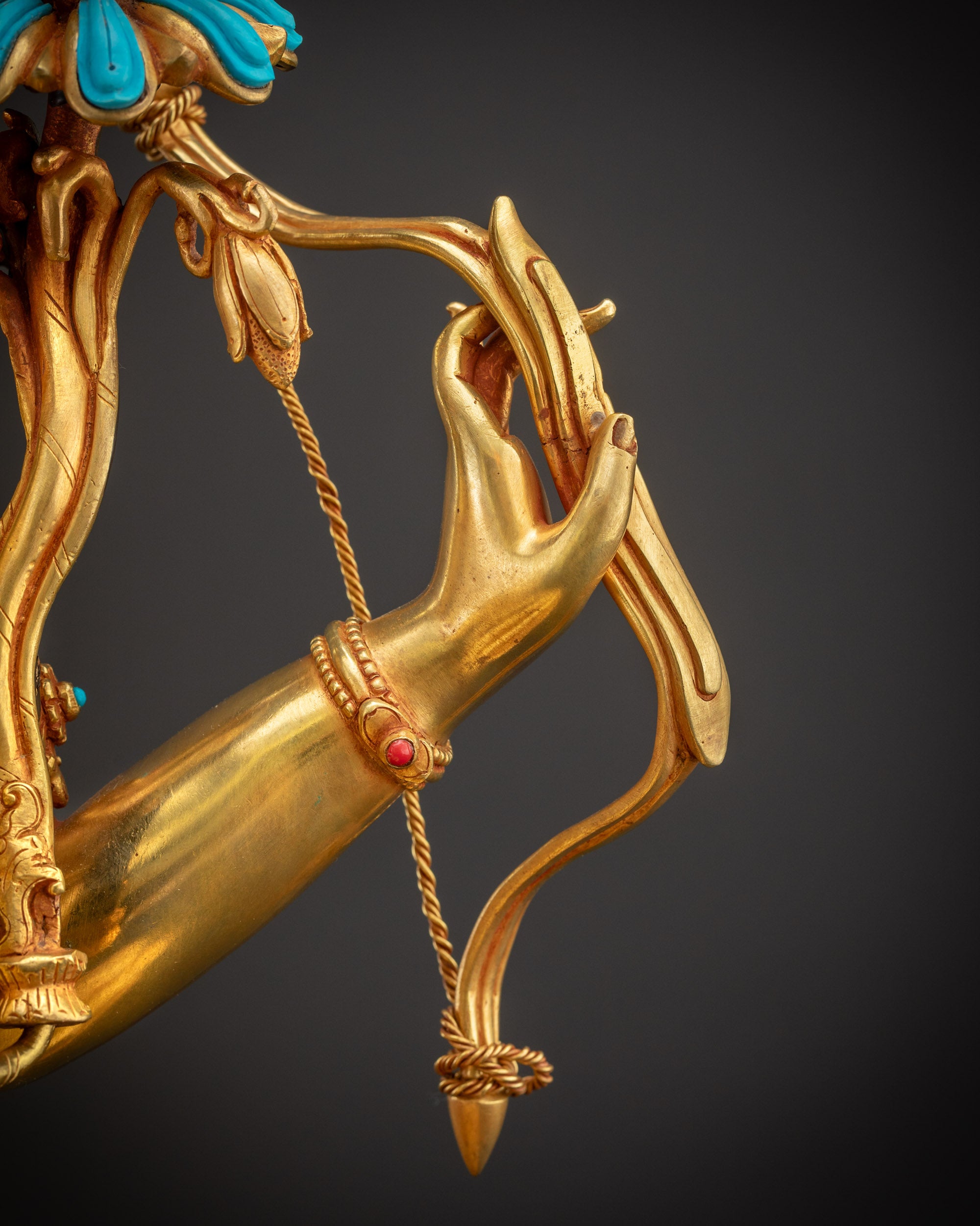 Detailed shot Maha Manjushri Statue bow symbolizing wisdom and insight