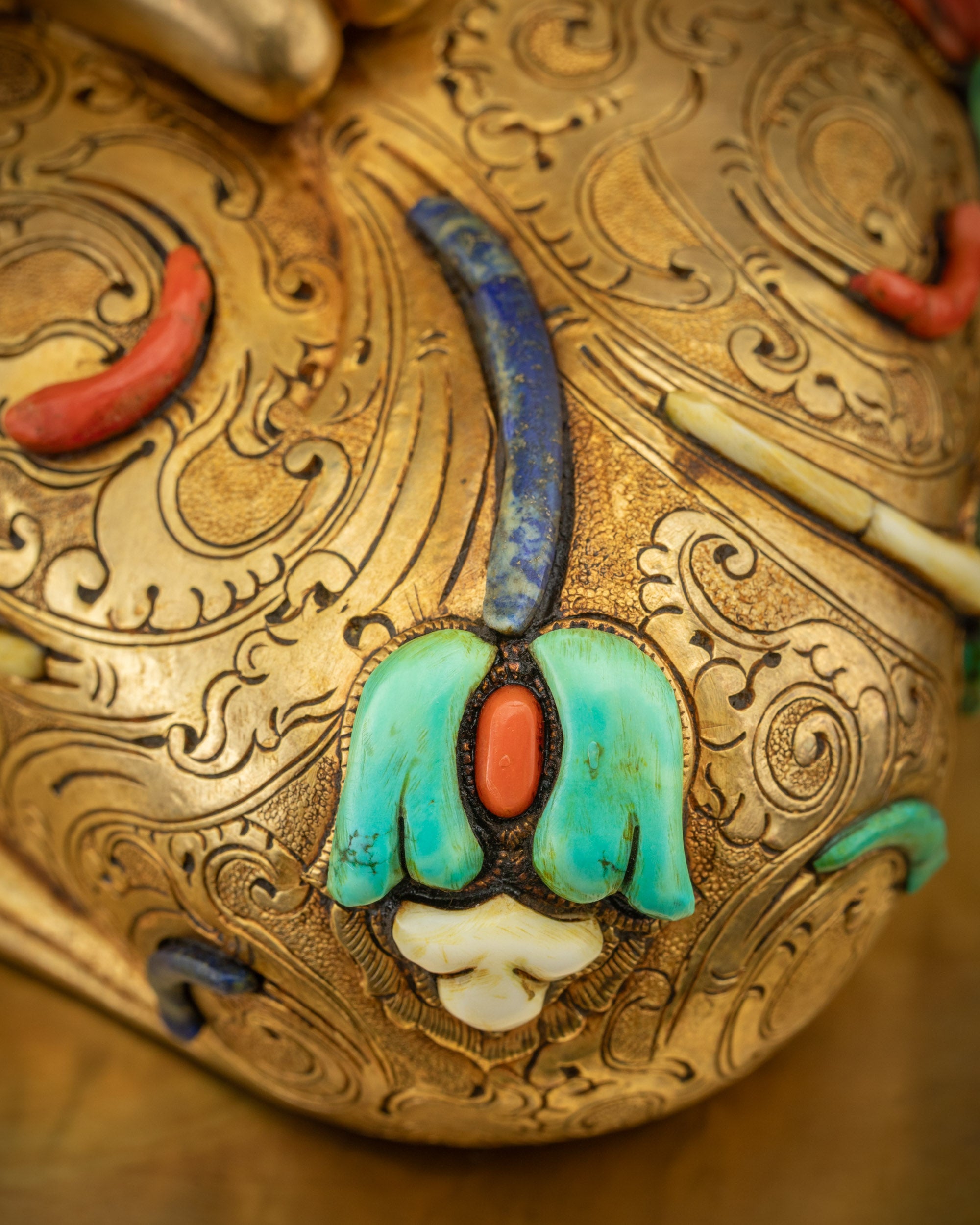 Detailed shot of Buddha robe featuring ornate floral motifs and fine Newari carvings