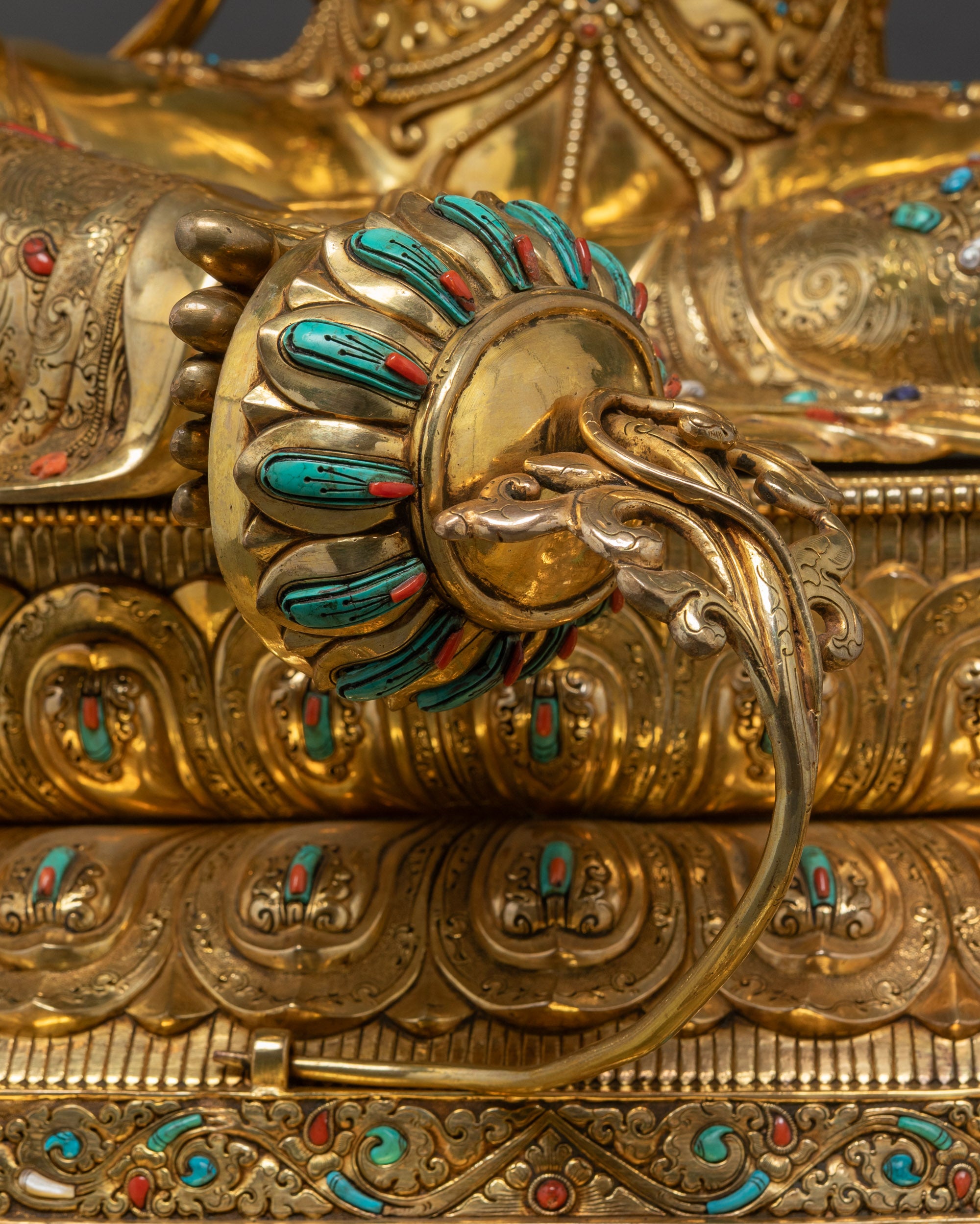 Detailed shot of Green Tara Statue placing foot blooming lotus beneath