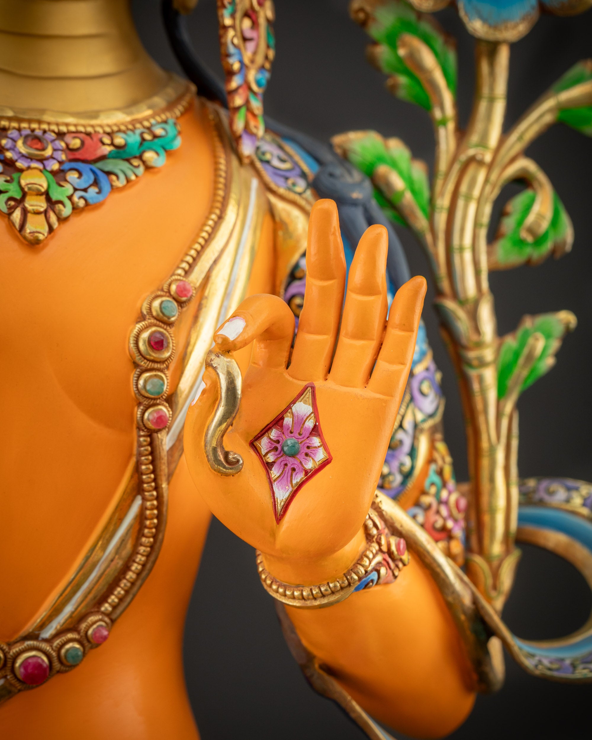 Detailed shot of Manjushri statue Holding utpala flower stem