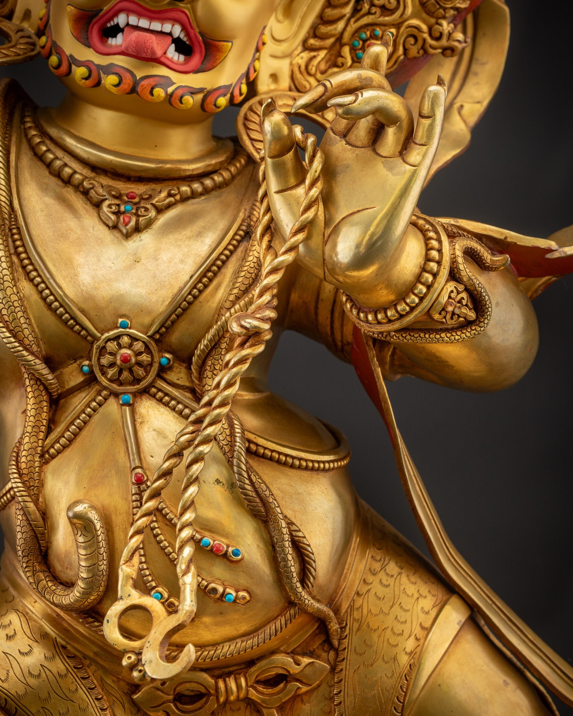 Detailed shot of Vajrapani Statue lasso showing intricate carvings