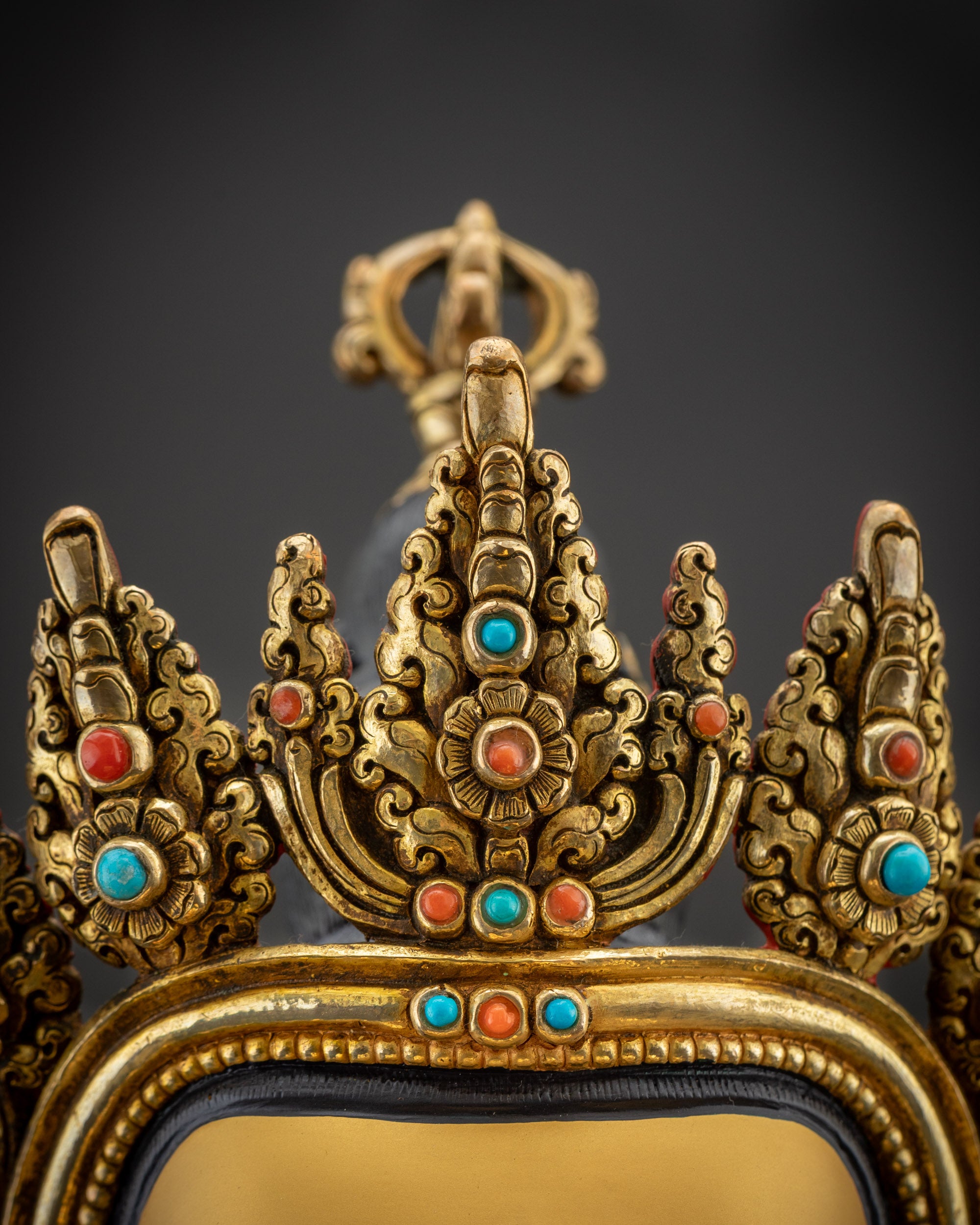 Detailed shot of Vajrasattva robe with golden texture and semi precious stones