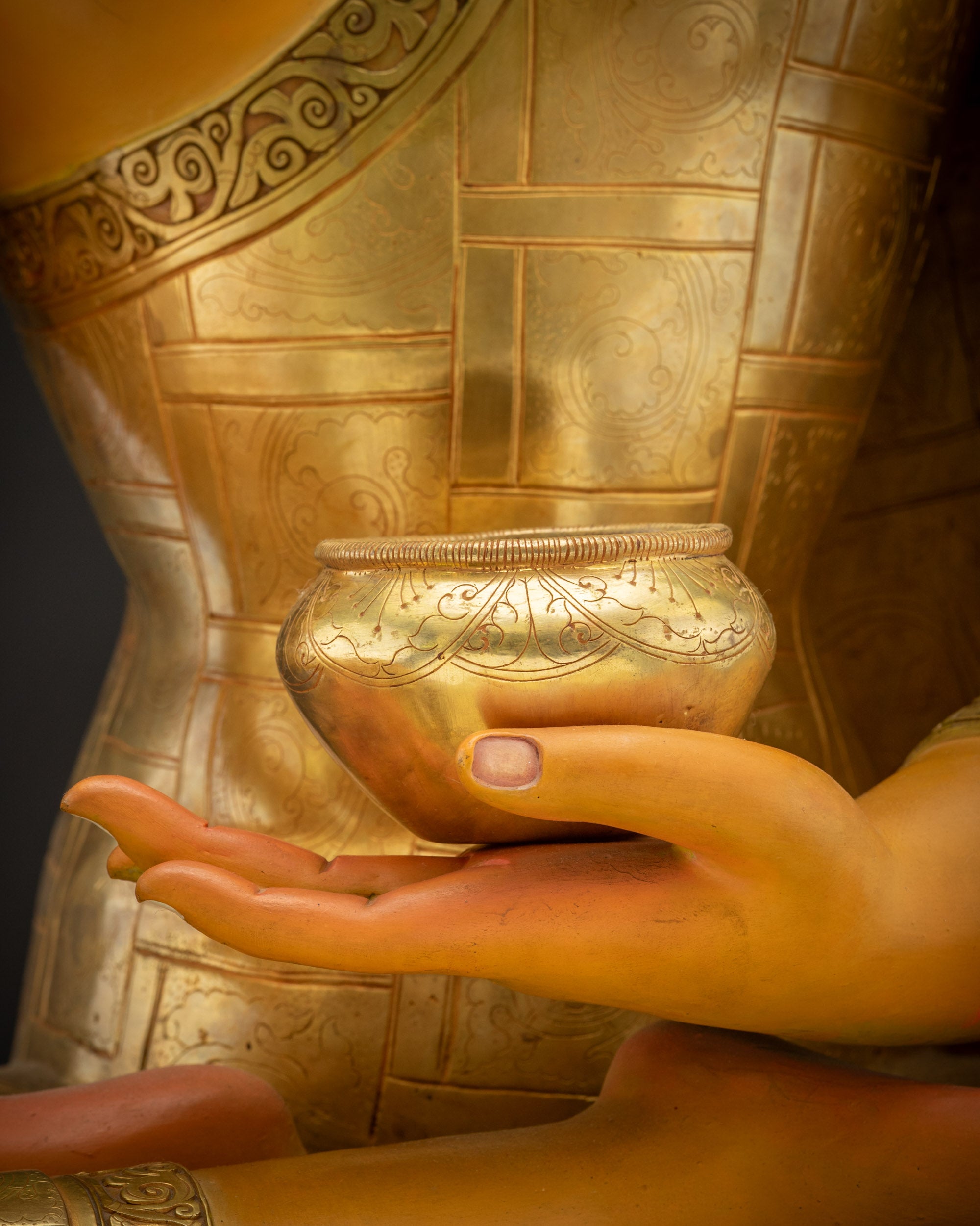 Detailed shot of begging bowl Shakyamuni Buddha Siddhartha Gautama Statue