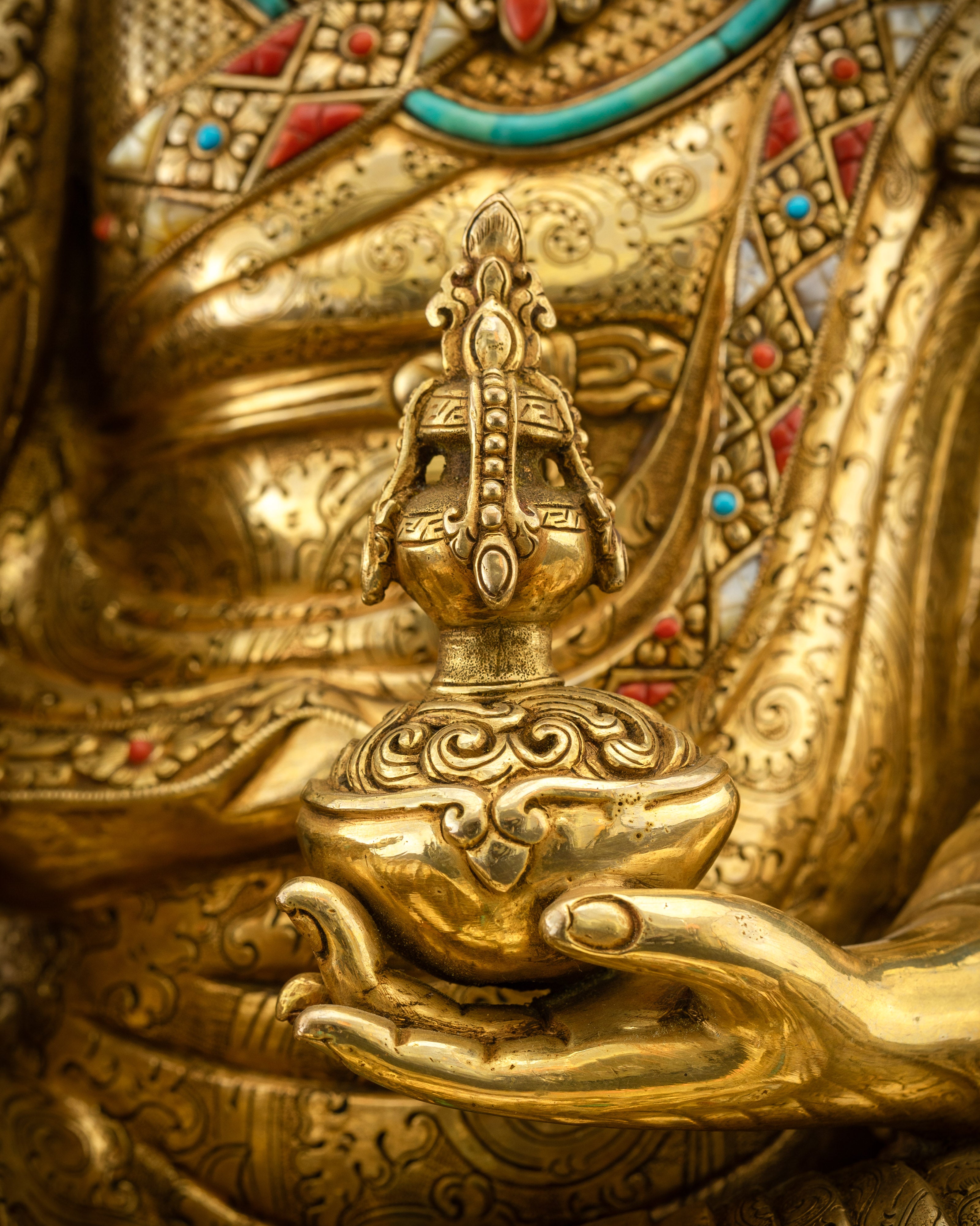 Detailed shot of kapala in left hand filled with nectar of immortality