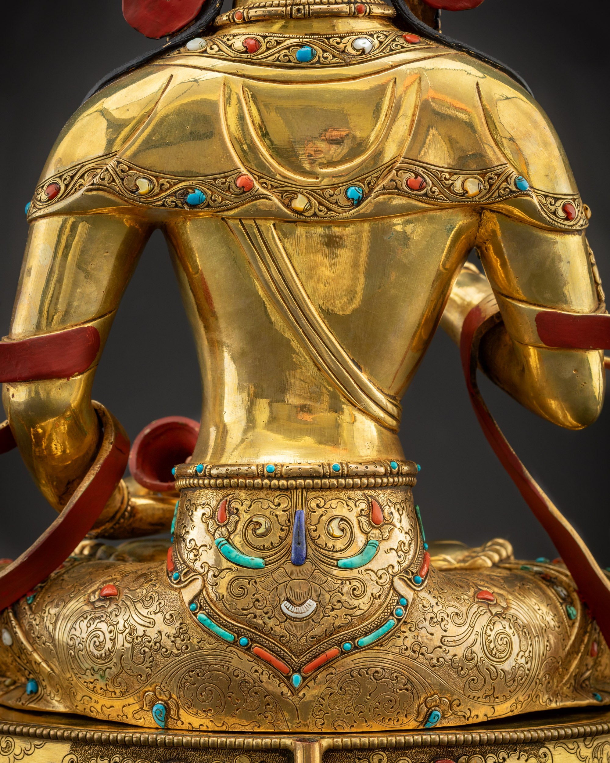Detailed shot of robe and stones on Vajrasattva showing rich texture and contrast