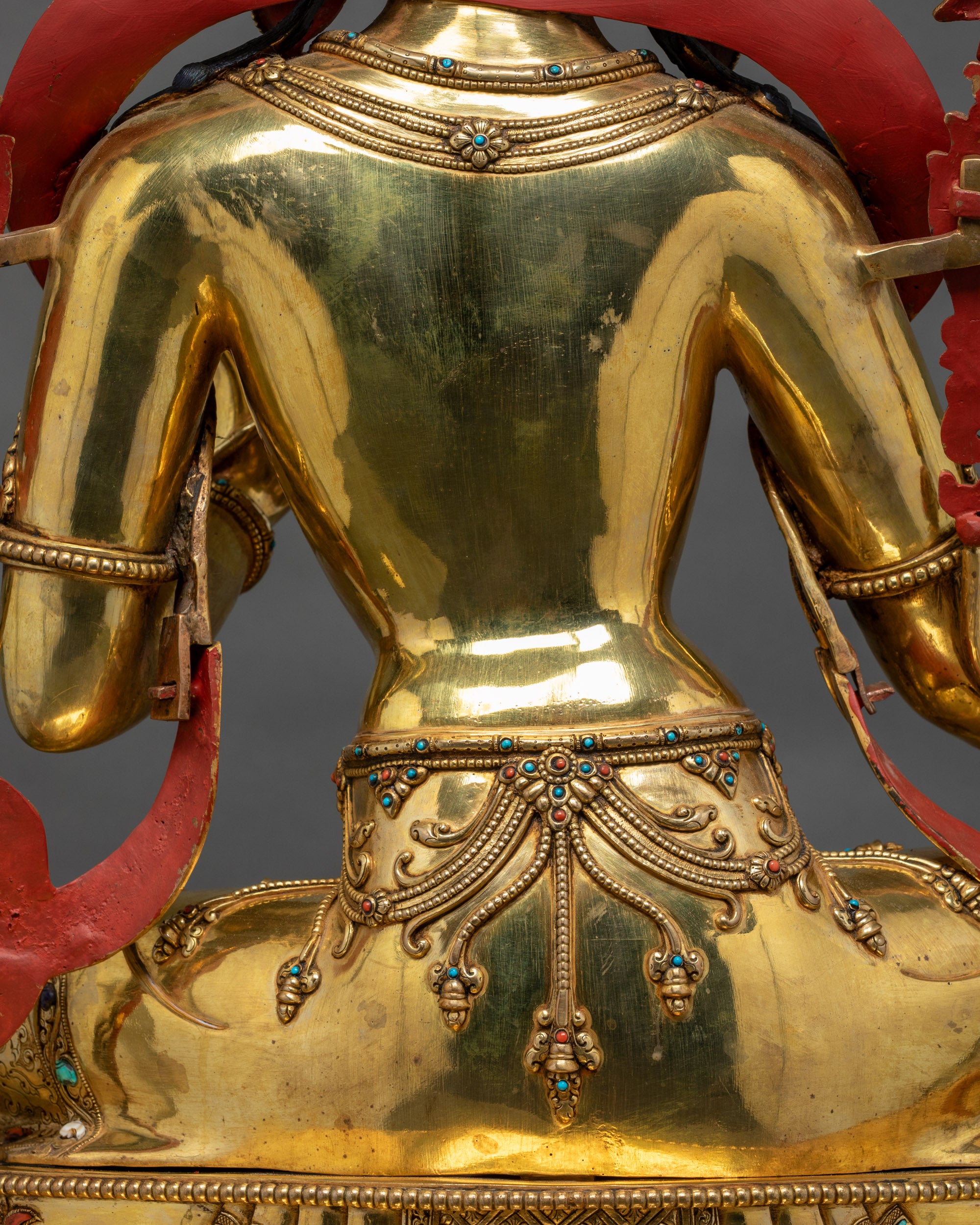 Detailed shot of swirling robes on handcrafted Nepalese Buddhist Tara