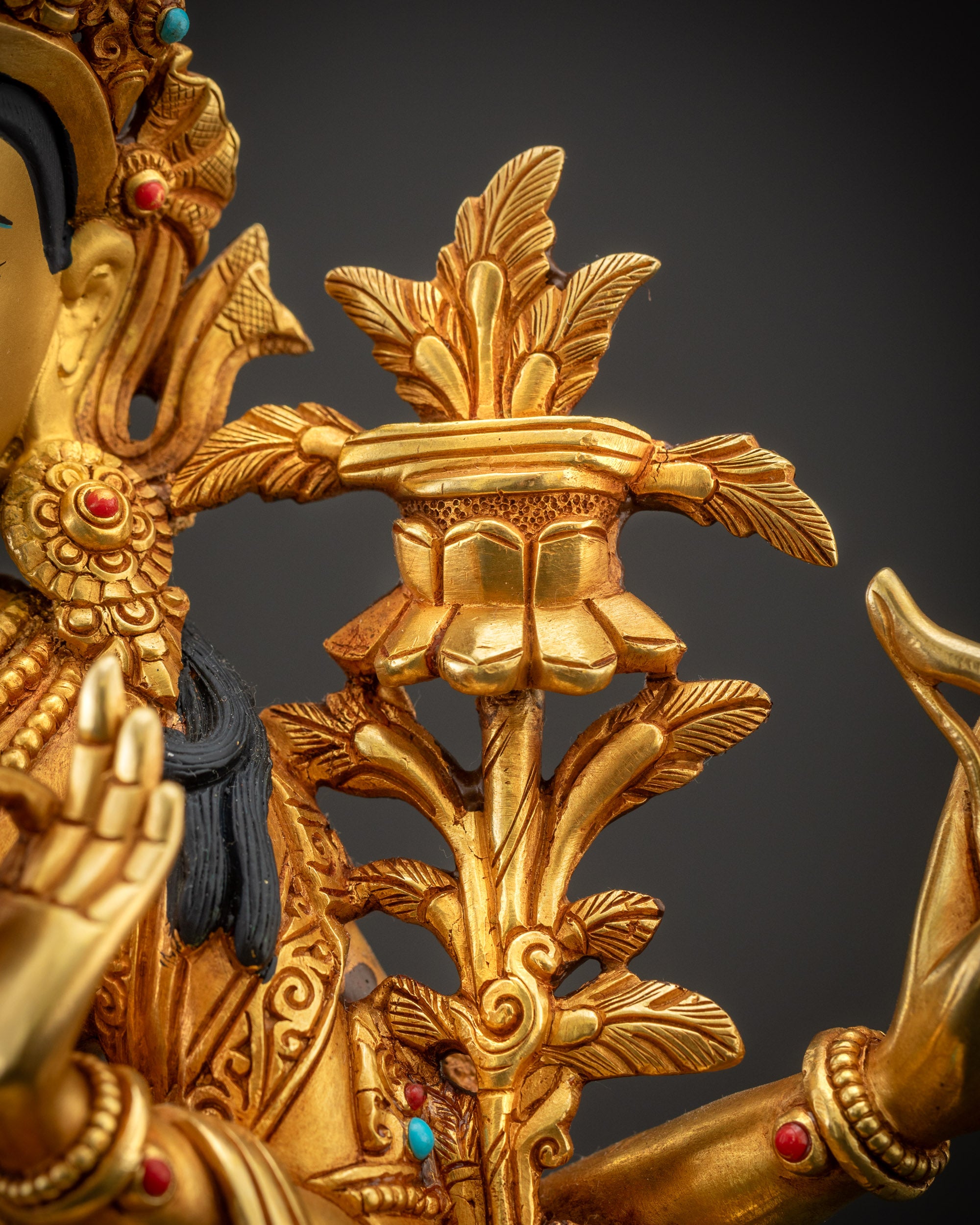Detailed shot of utpala flower of Maha Manjushri statue showing Sutra scroll in left hand