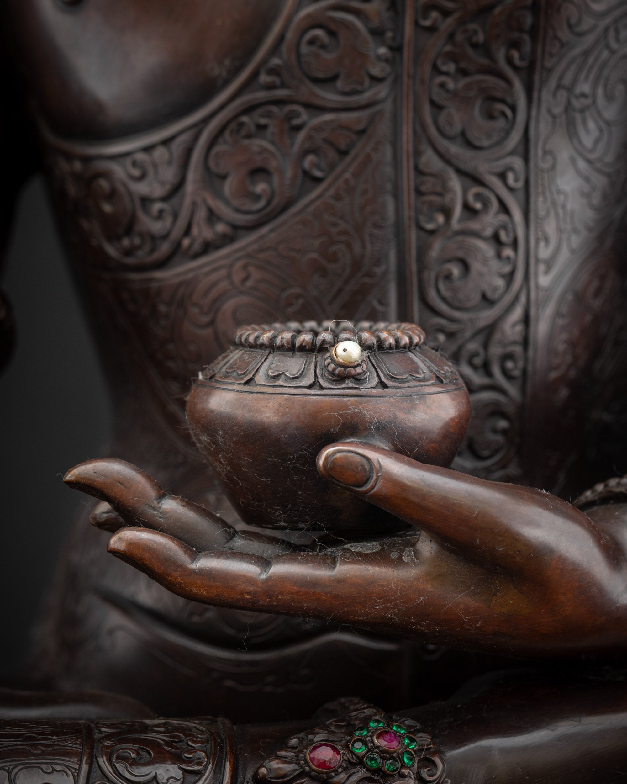 Detailed shot oxidized copper begging bowl of Shakyamuni Buddha altar statue