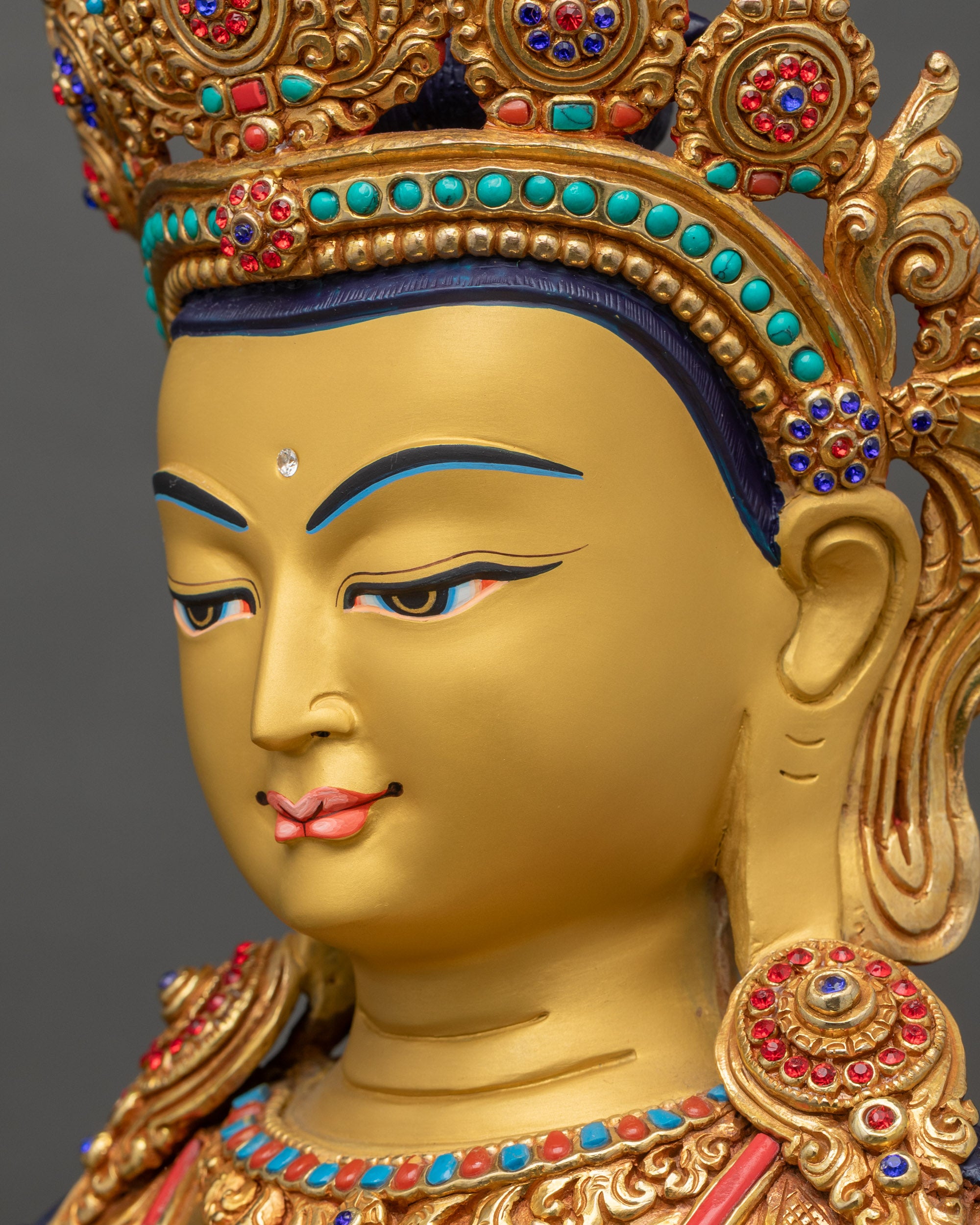 Detailed side close-up of Amitayus face with radiant gold fire-gilding