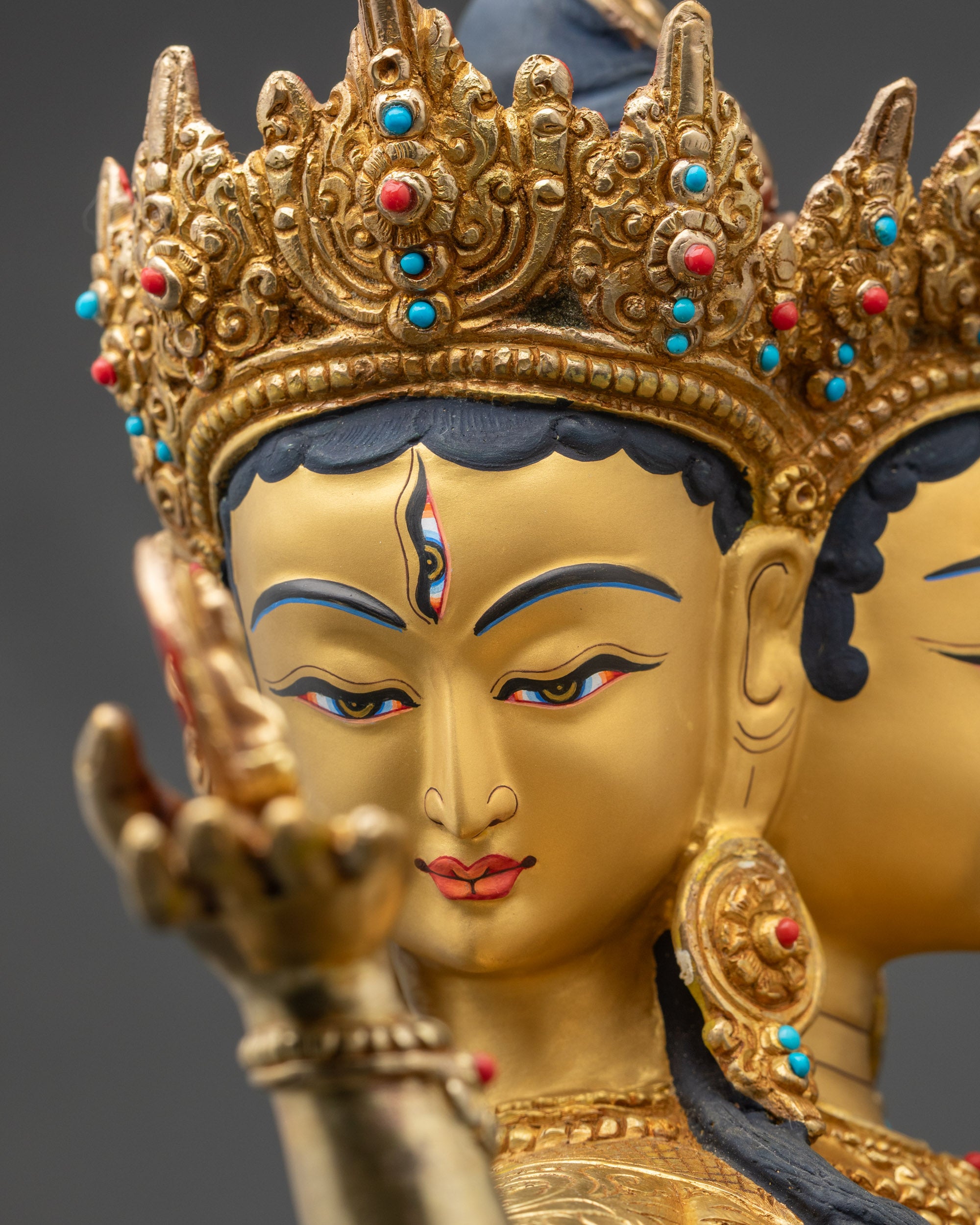 Detailed side close-up of Namgyalma sculpture, handcrafted Nepalese copper with intricate fire-gilded features