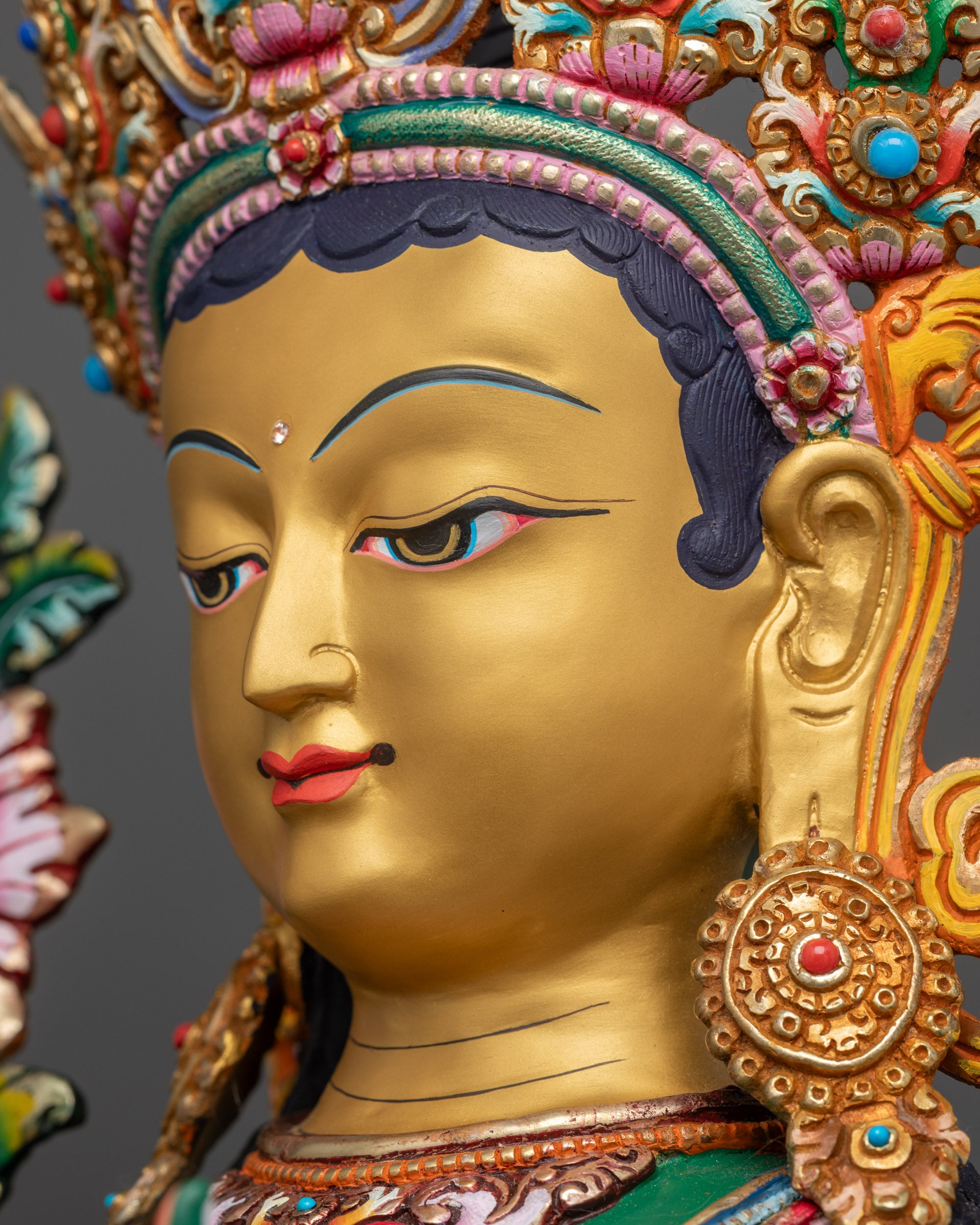 Detailed side close up face Green Tara goddess side view face with crown details