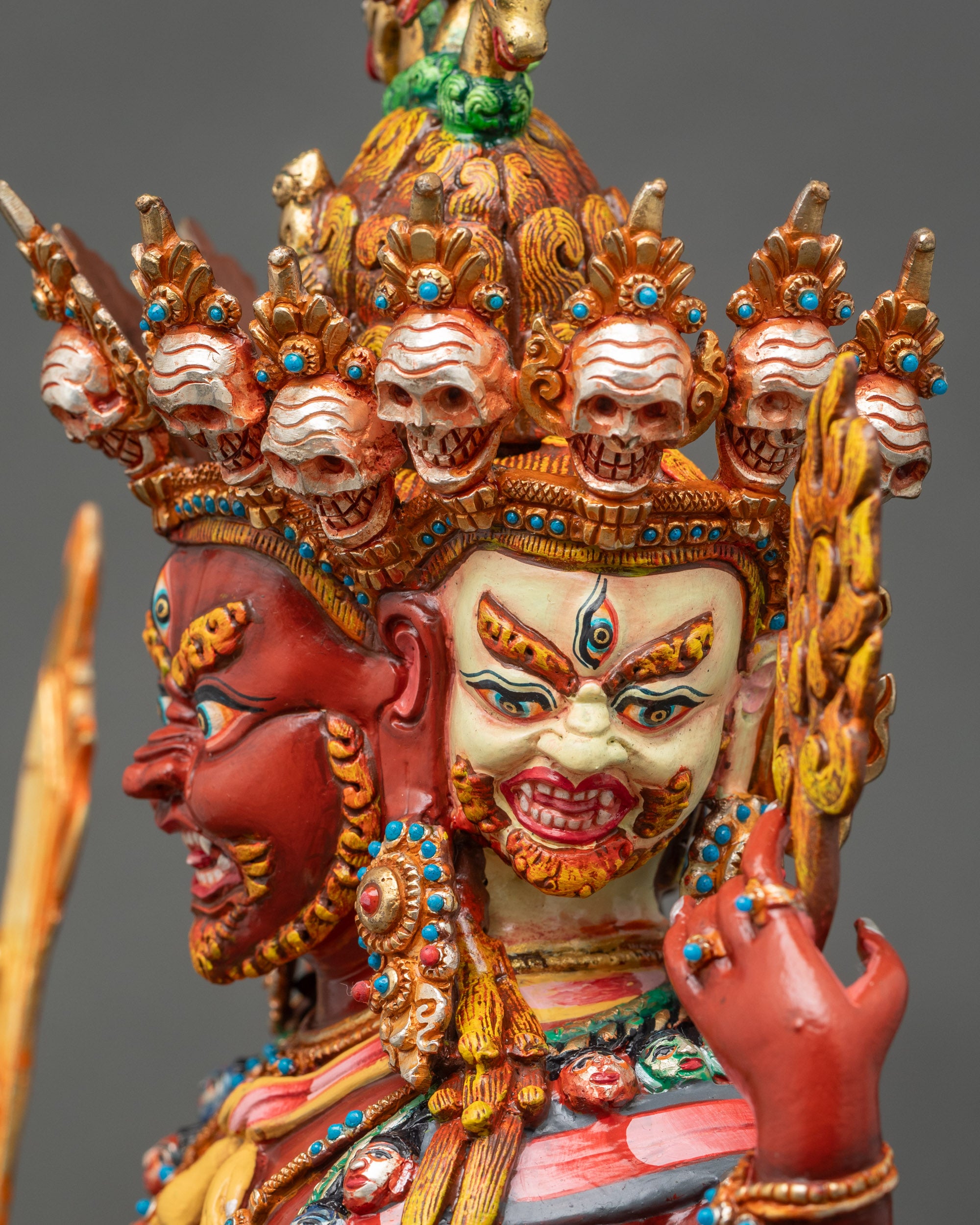 Detailed side close up face: Hayagriva statue face side close-up with gold fire-gilded features