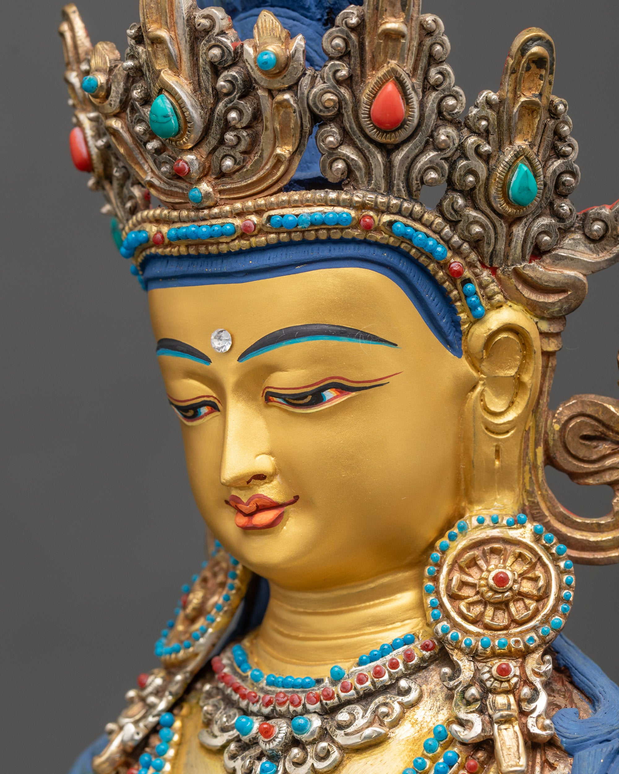 Detailed side close up face of Mitrugpa Buddha Statue with serene features and refined detailing