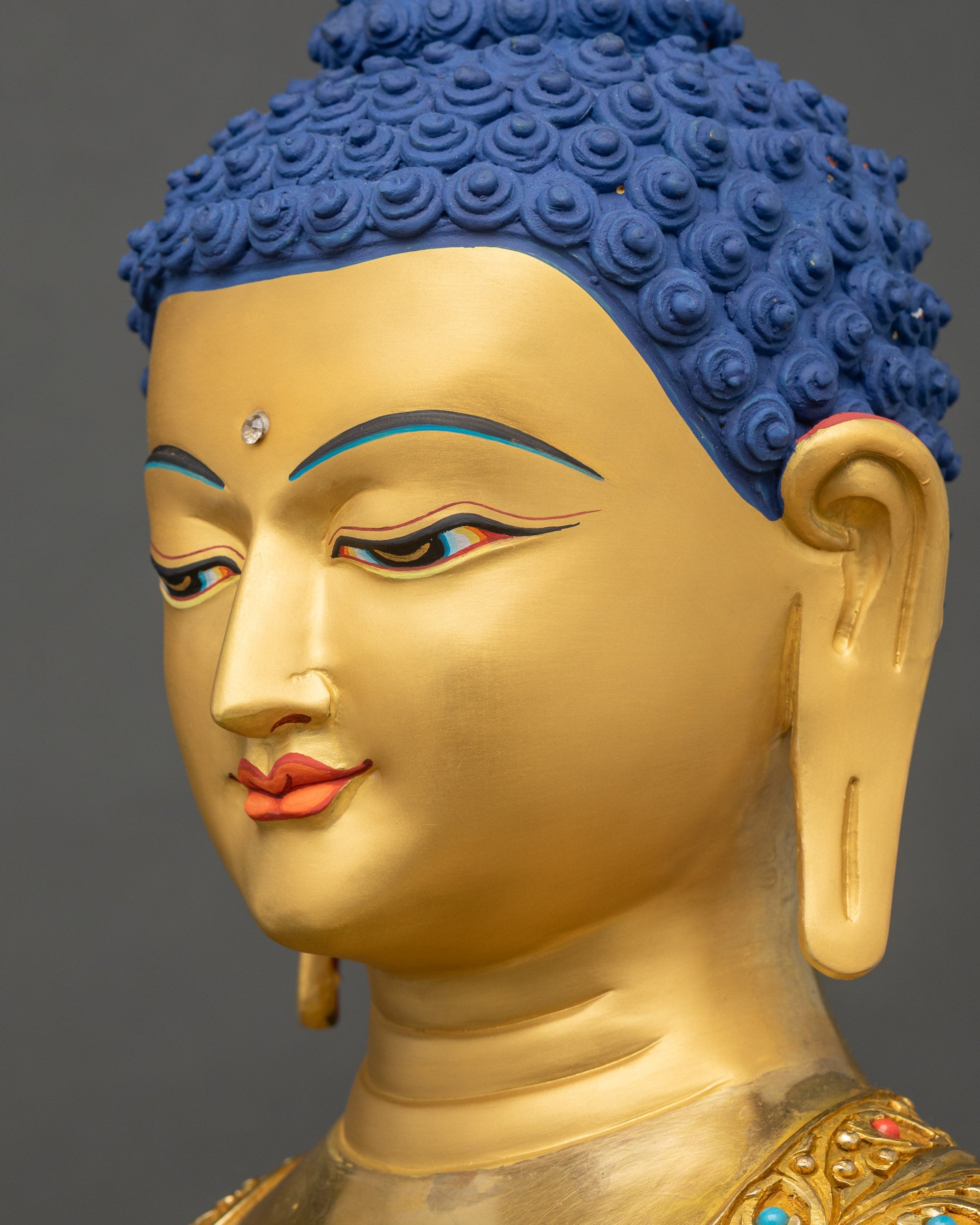 Detailed side close up face of Shakyamuni Buddha Sculpture with calm meditation expression
