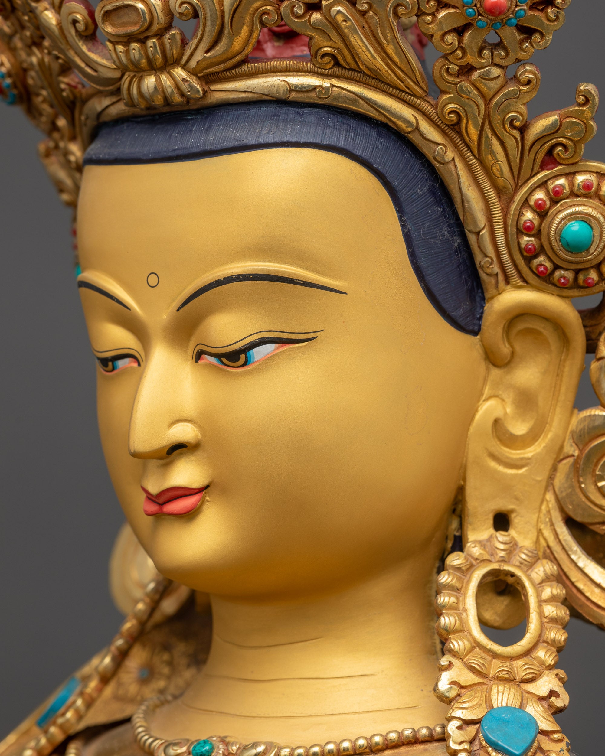 Detailed side close up face of Vajradhara statue reflecting calm Primordial Buddha gaze