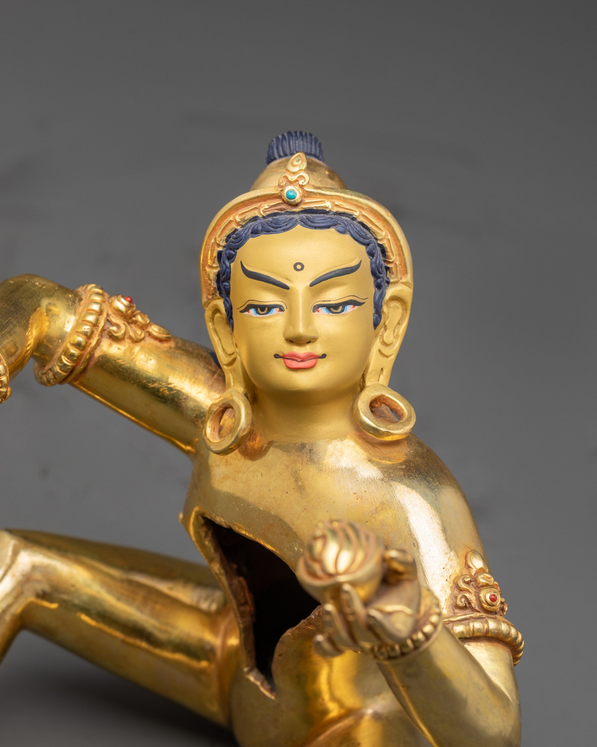 Detailed side close up of Padmasambhava Yab-Yum Yeshe Tsogyal statue seated on lotus pedestal