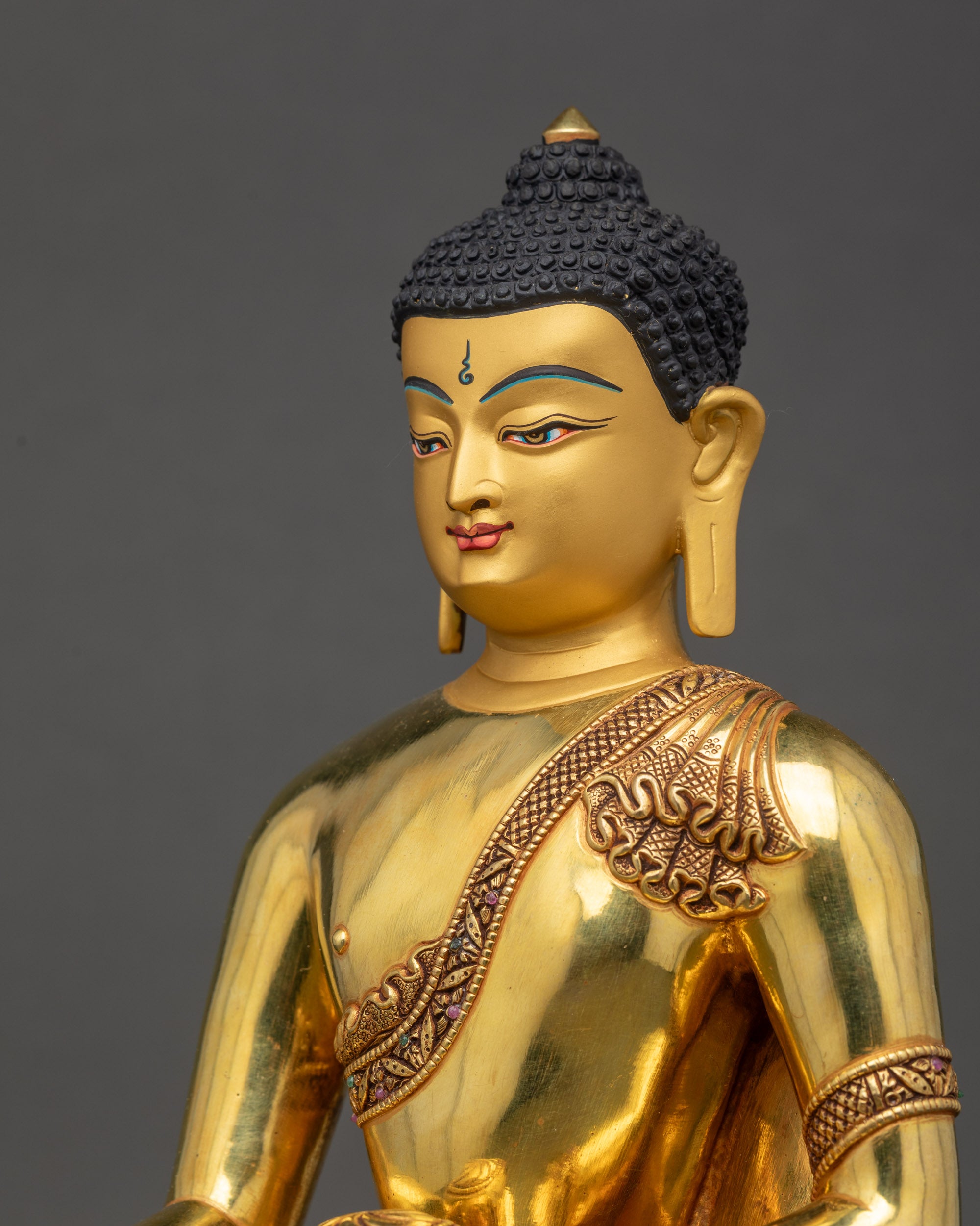 Detailed side close up of Shakyamuni Buddha Statue highlighting intricate robe patterns