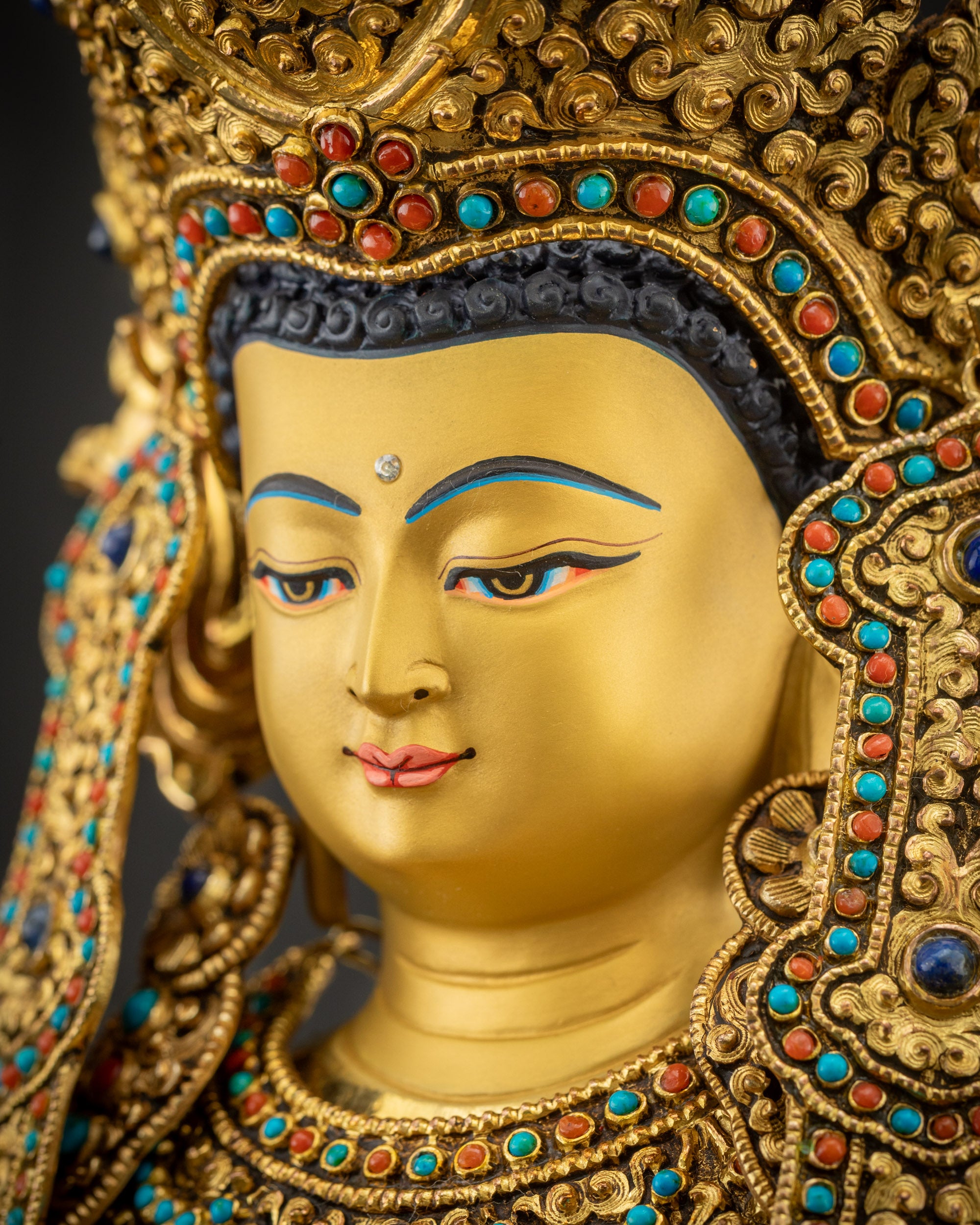 Detailed side close up of serene face of handcrafted Jowo Rinpoche Buddha