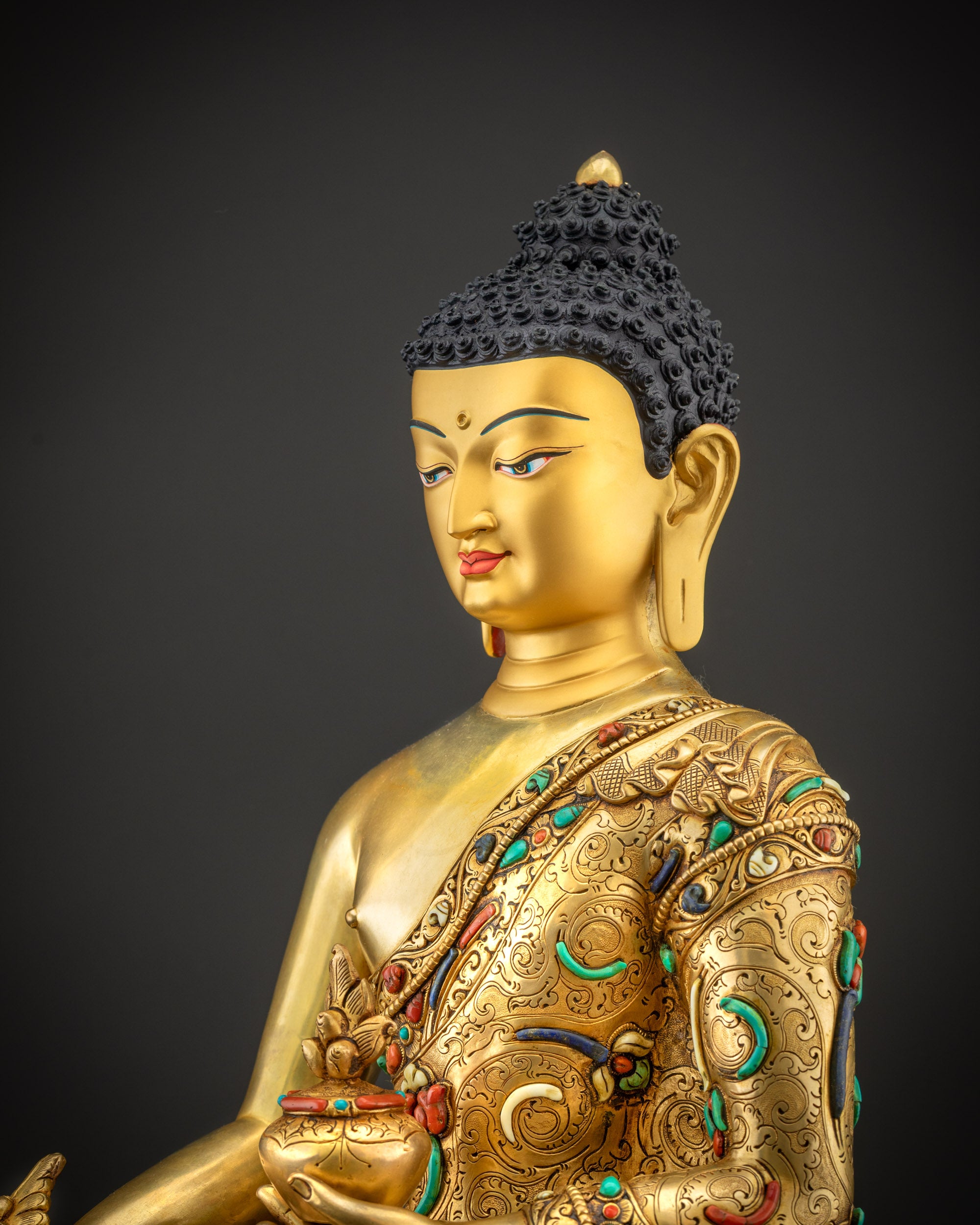Detailed side face of Medicine Buddha showing halo, gold texture, and facial carvings clearly