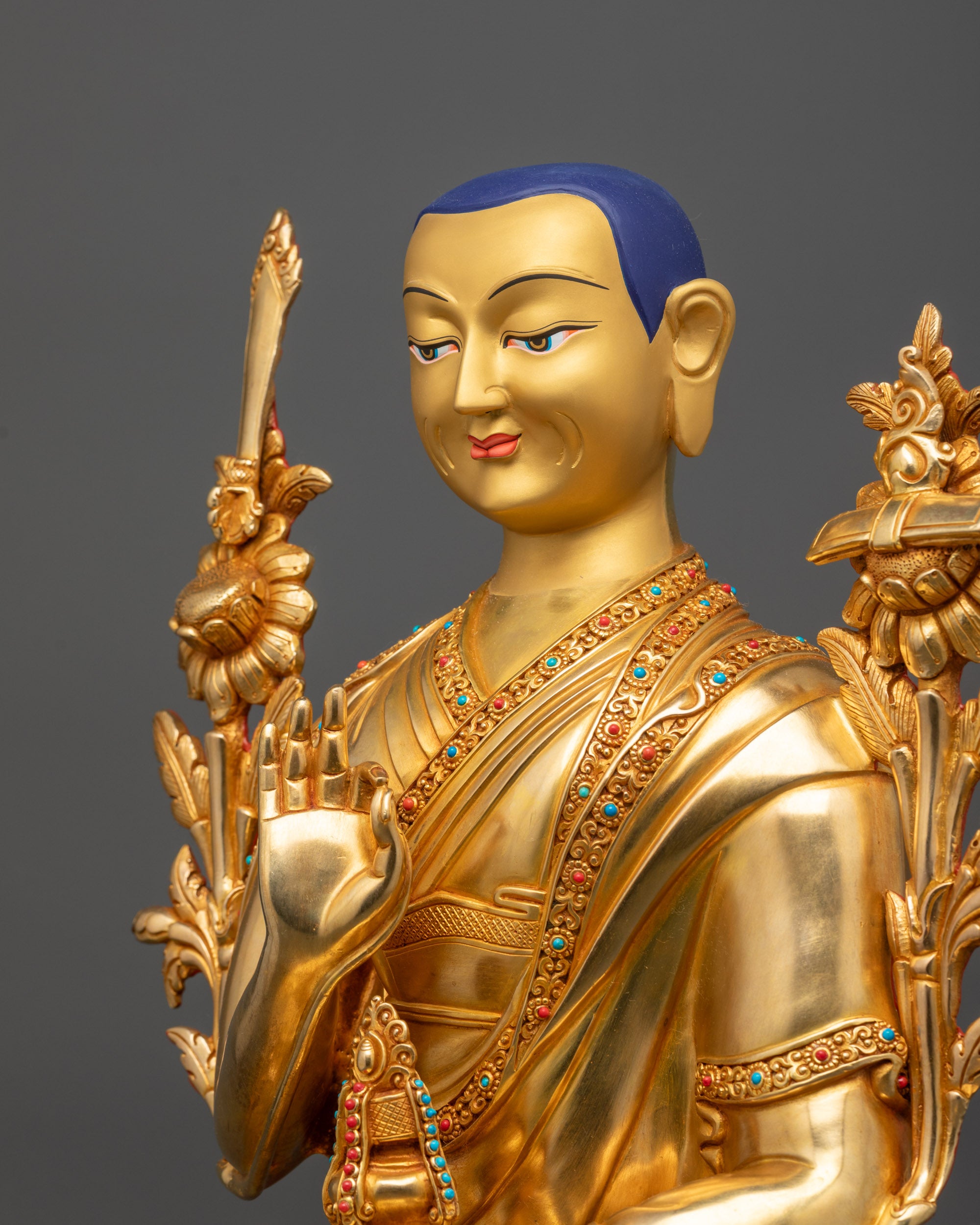 Detailed side view Je Tsongkhapa Statue showing intricate robe motifs and polished finish