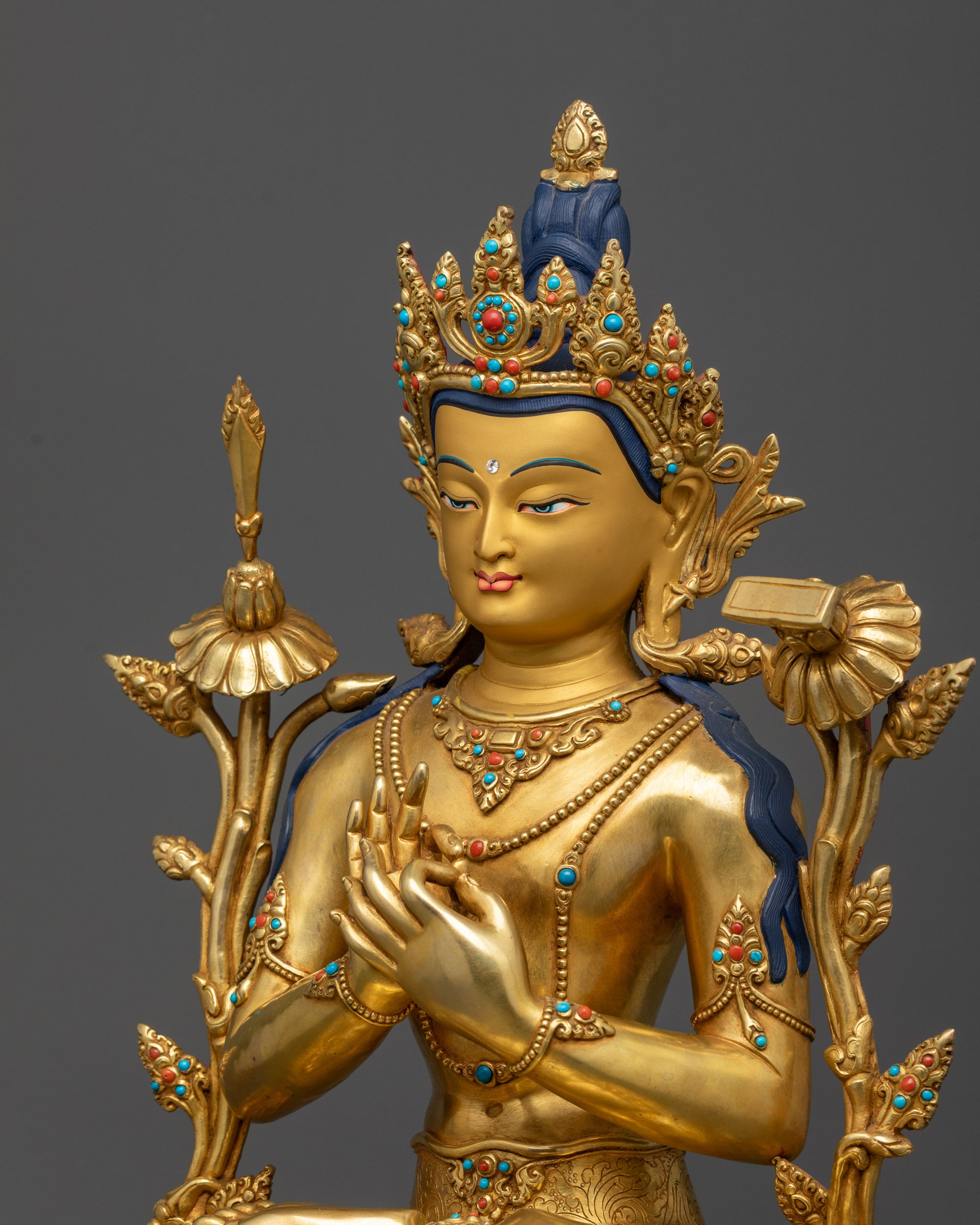 Detailed side view Manjushri Statue showing floral garment and lotus meditation seat