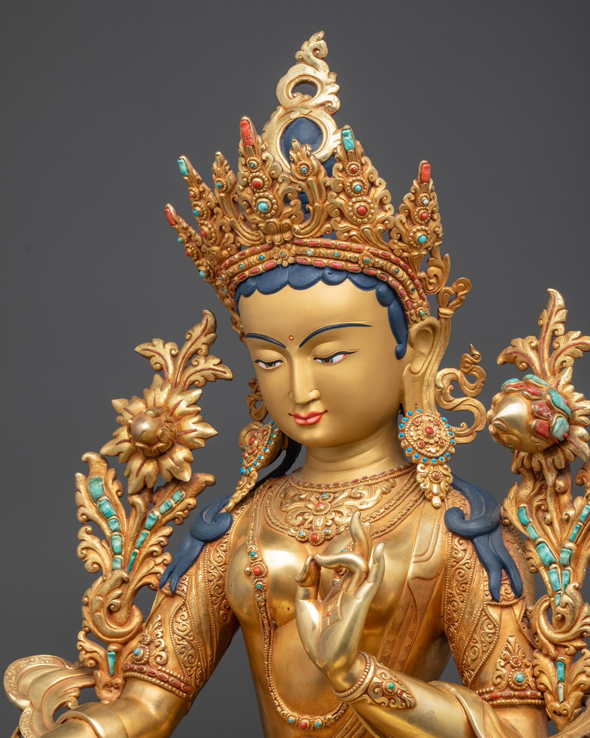 Detailed side view of Green Tara Statue highlighting crown and robes
