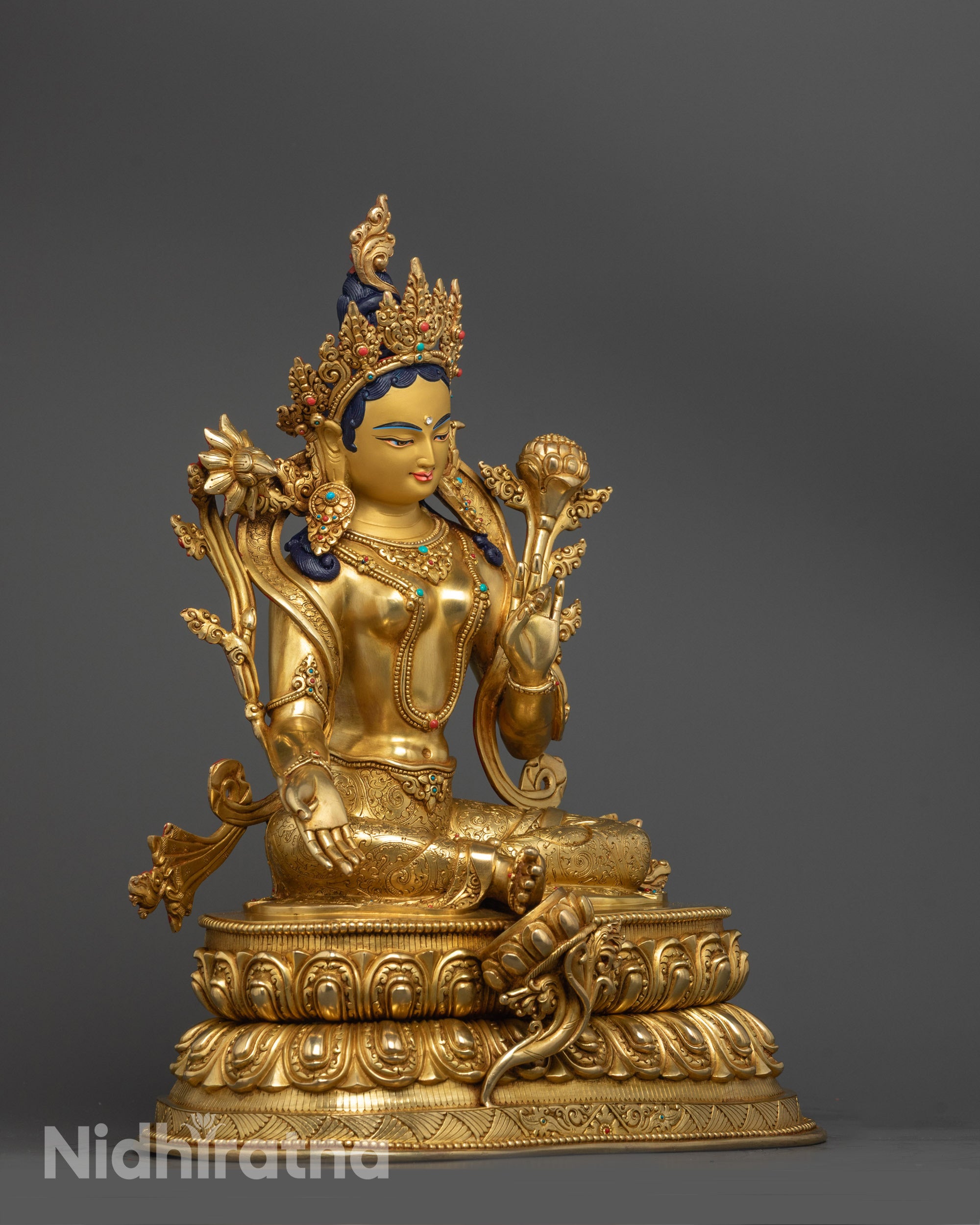 Detailed side view of Nepalese Green Tara Statue showing intricate lotus base