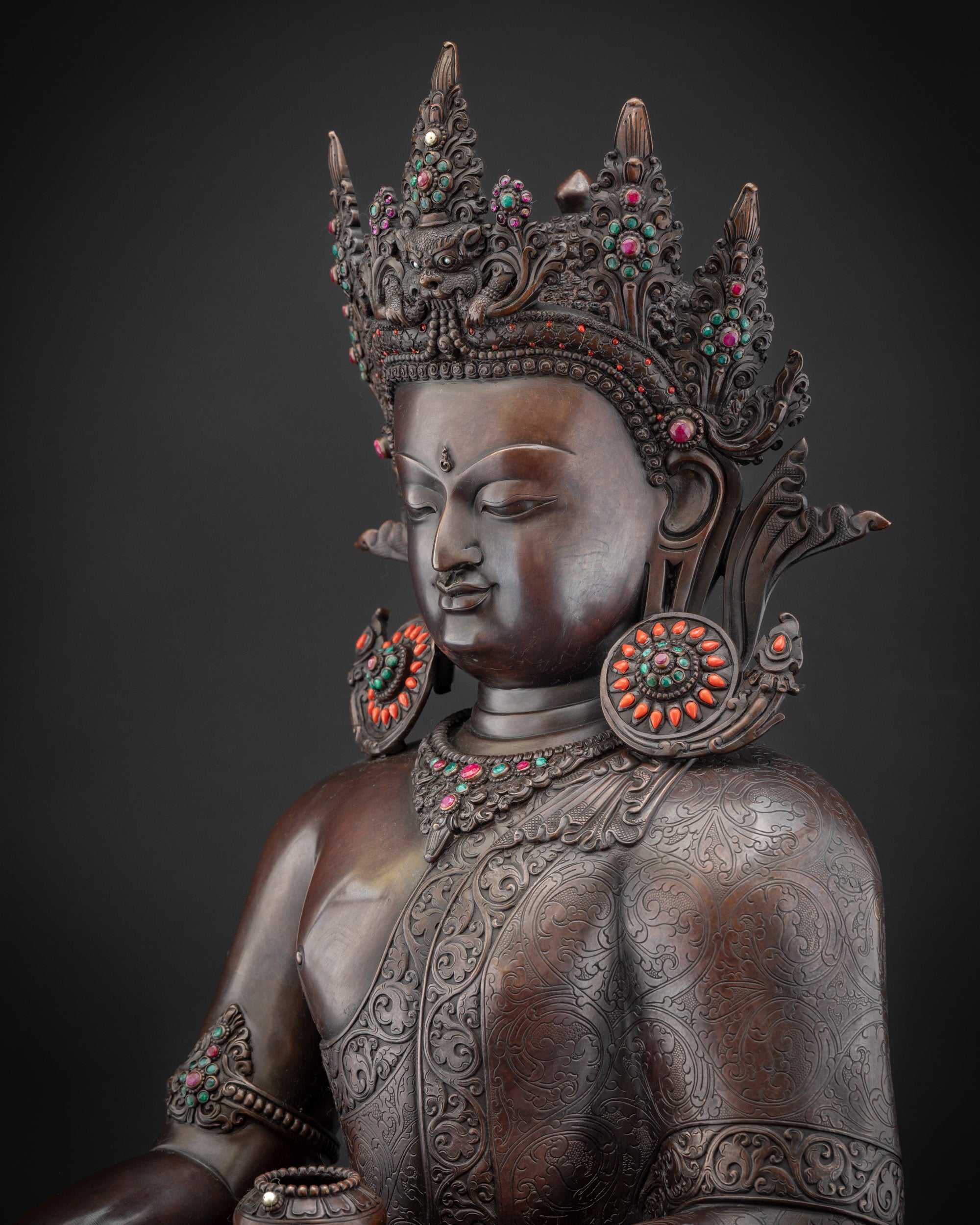 Detailed side view oxidized Buddha Shakyamuni figurine with layered monk’s robe