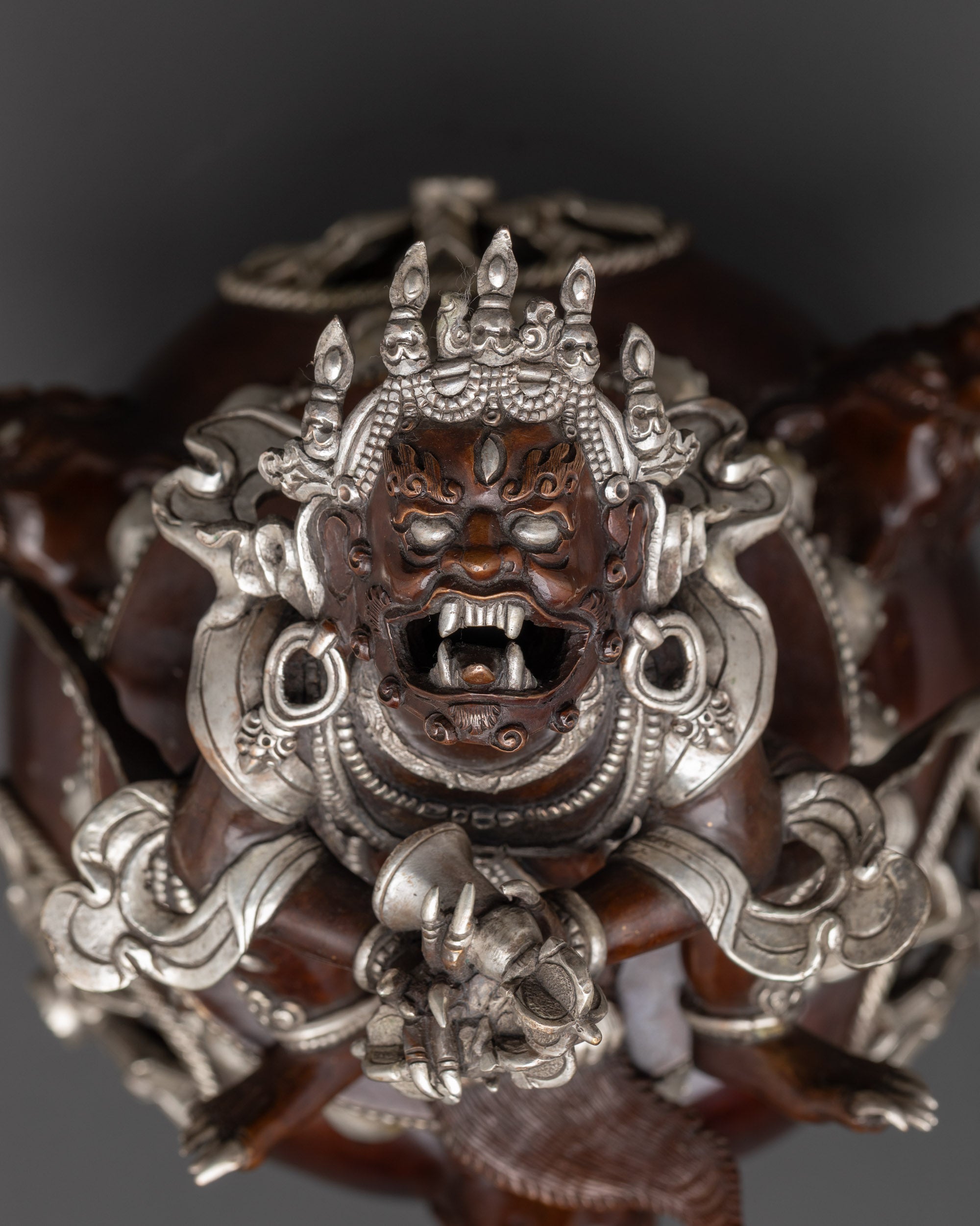 Detailed upper close up of vajra and tiger-skin garment on Vajradhaka Statue