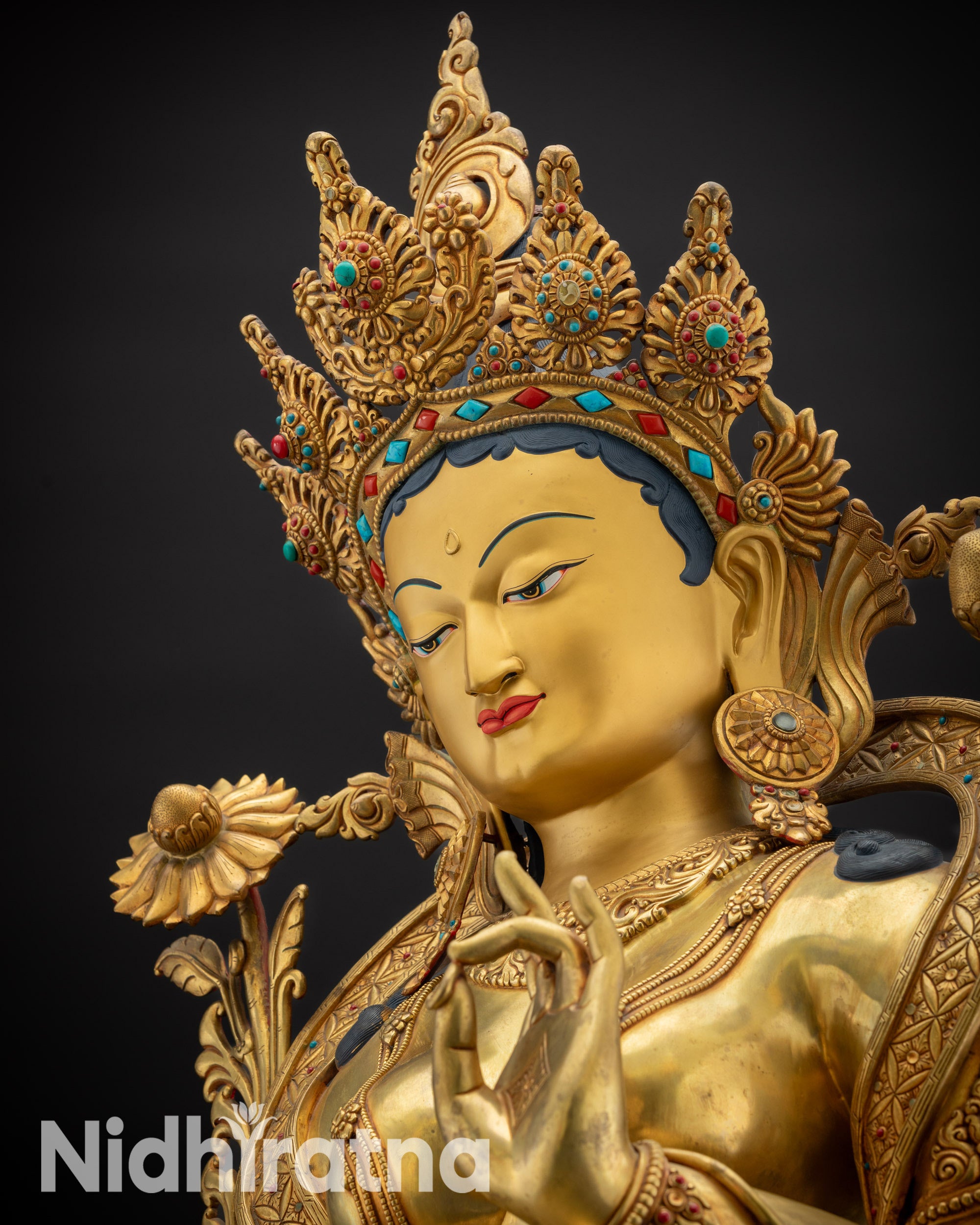 Detailed upper view of Masterpiece Green Tara Statue showing gold-gilded face and crown details