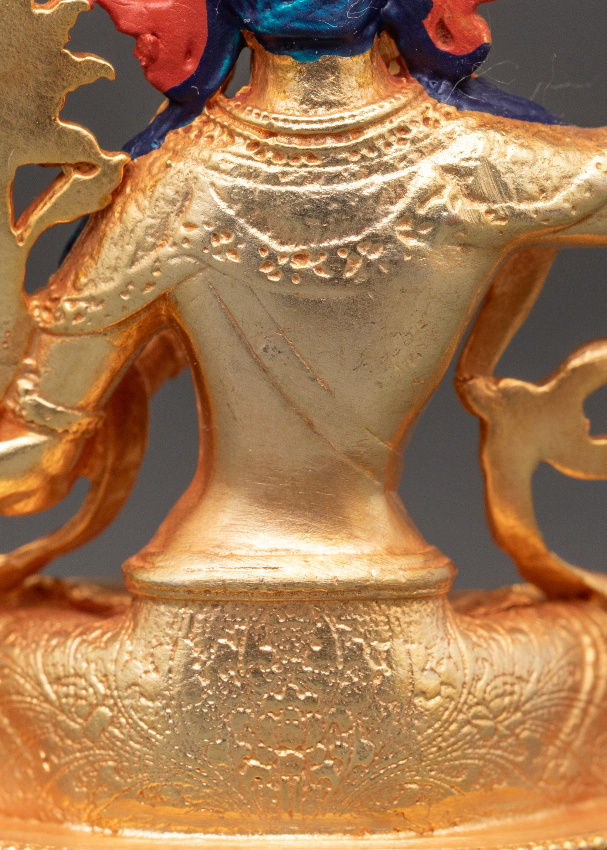 Detailed view of Manjushri statue with utpala flower and lotus throne, Nepalese sculpture