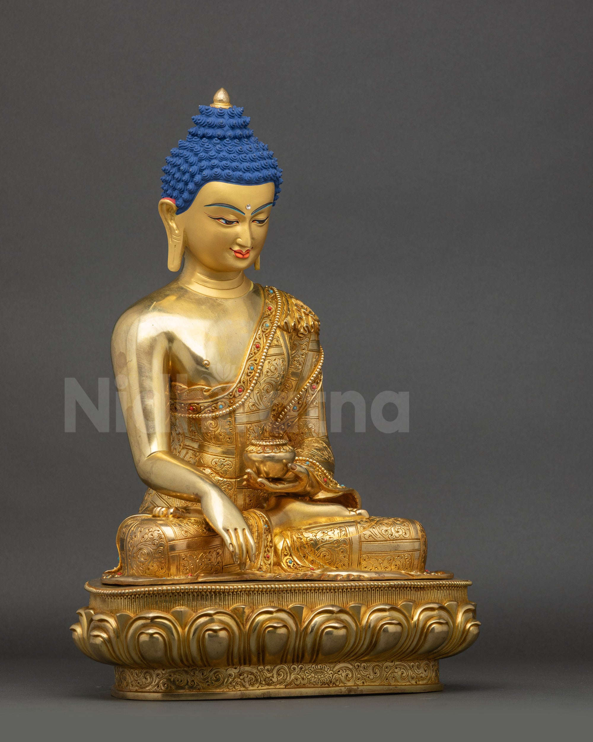 Detailed view of Shakyamuni Buddha statue highlighting radiant & refined gold fire gilding