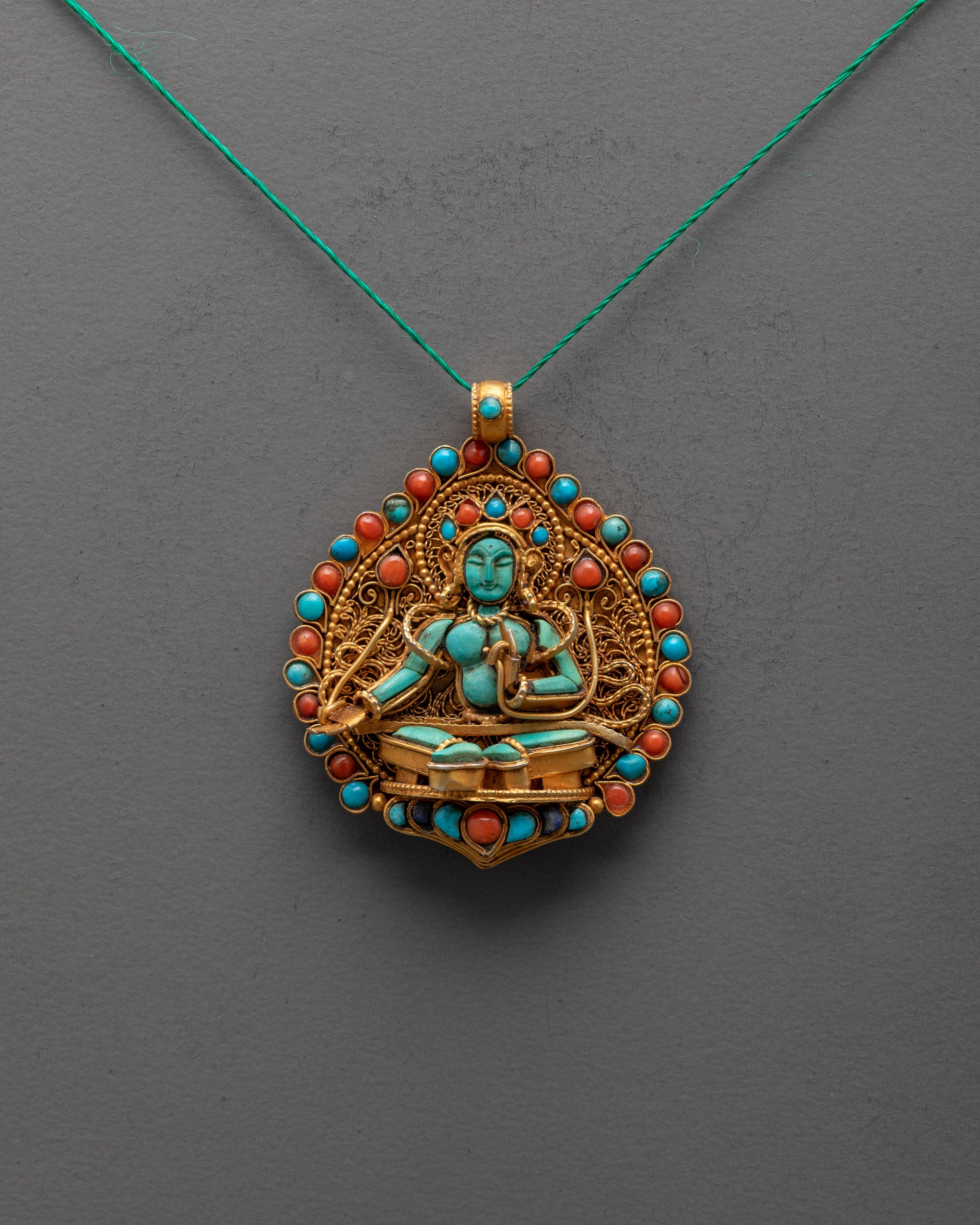Divine Mother Tara Locket front view with gold filigree and coral, turquoise, lapis stones, Nepalese craftsmanship