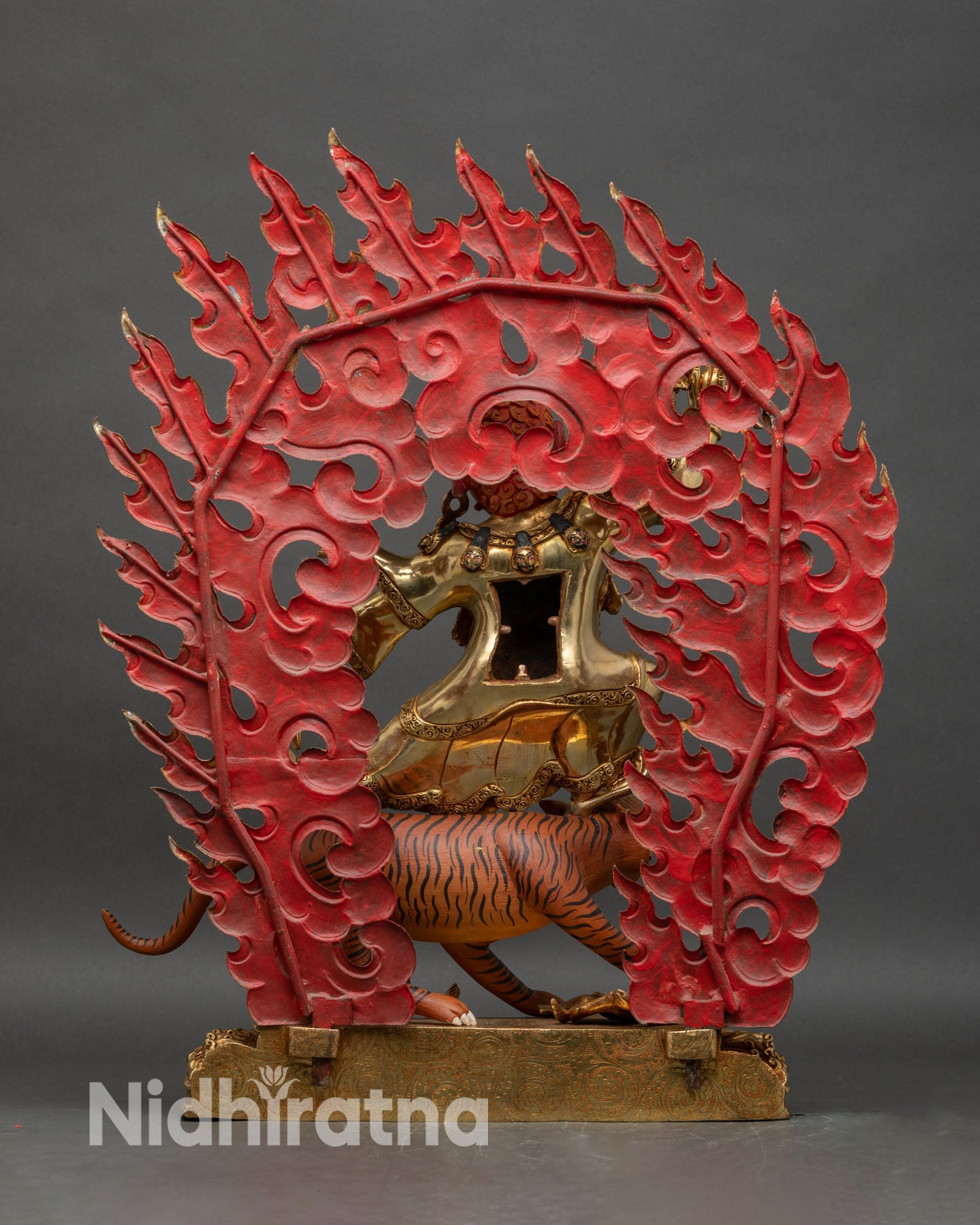 Dorje Drolo statue back showing lotus throne and engraved halo with color inlays
