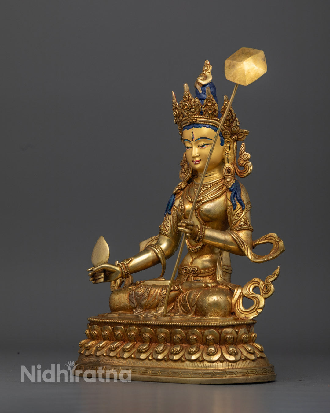 Dukar statue with finely carved robe and crown representing the artistry of Nepalese Buddhist sculpture