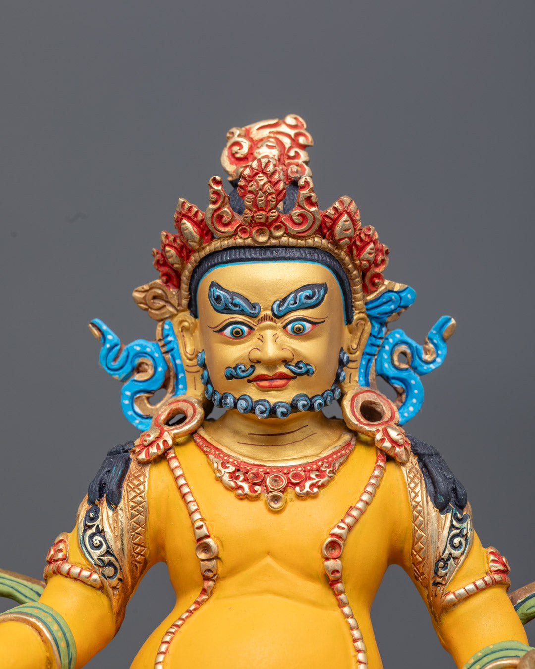 Dzambhala Statue featuring ornate five-jeweled crown, intricate jewelry, flowing robe, and luminous halo