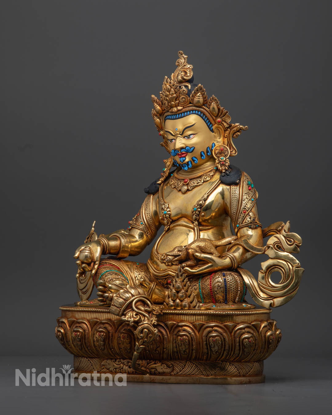 Hand-carved Dzambhala statue with 24k gold-plated face symbolizing wealth and prosperity