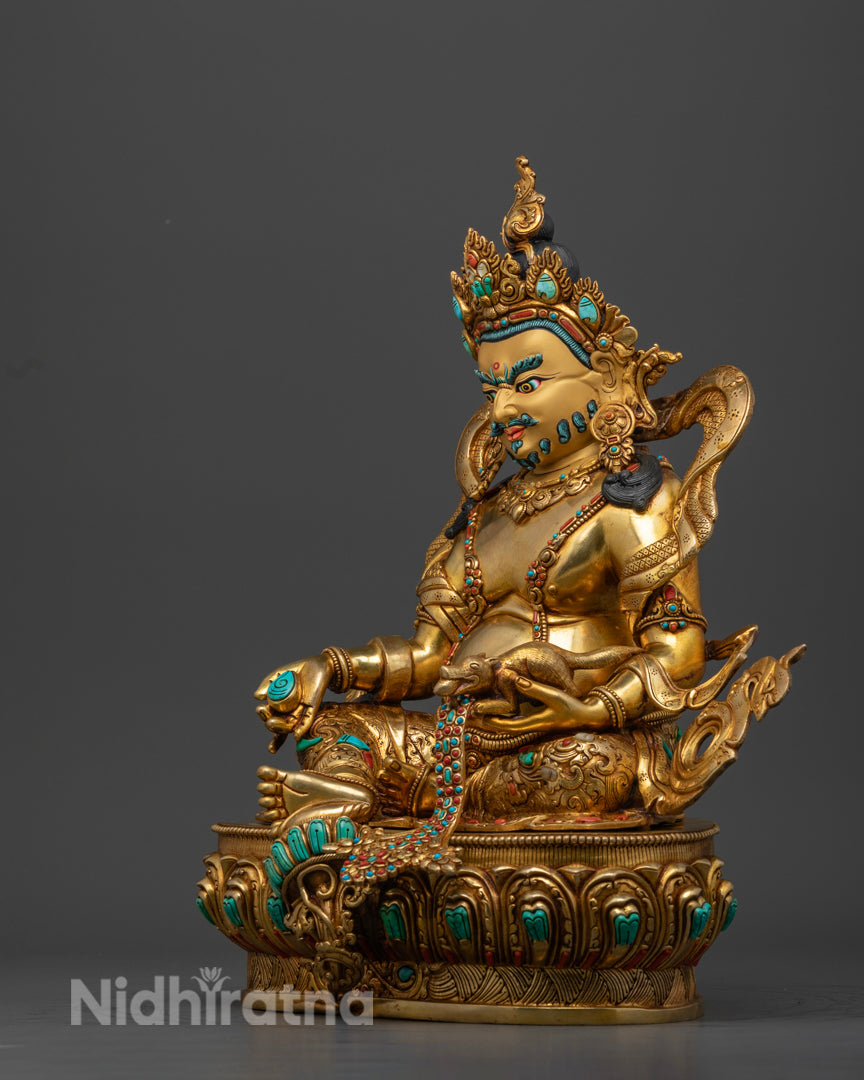 The side profile of gold plated Dzambala adorned with semi precious gemstones | Dzambala meditation statue | Dzambala deity statue with mongoose