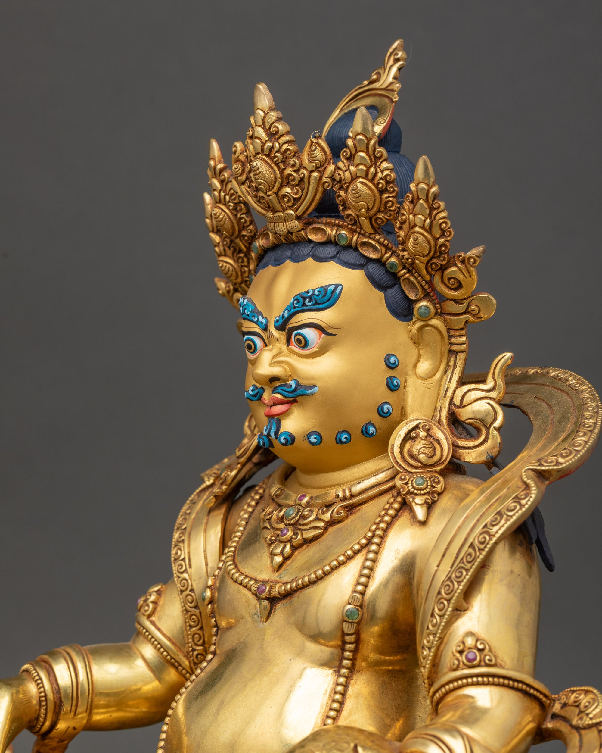 Dzambhala Statue side close up showing citrion fruits and jewels